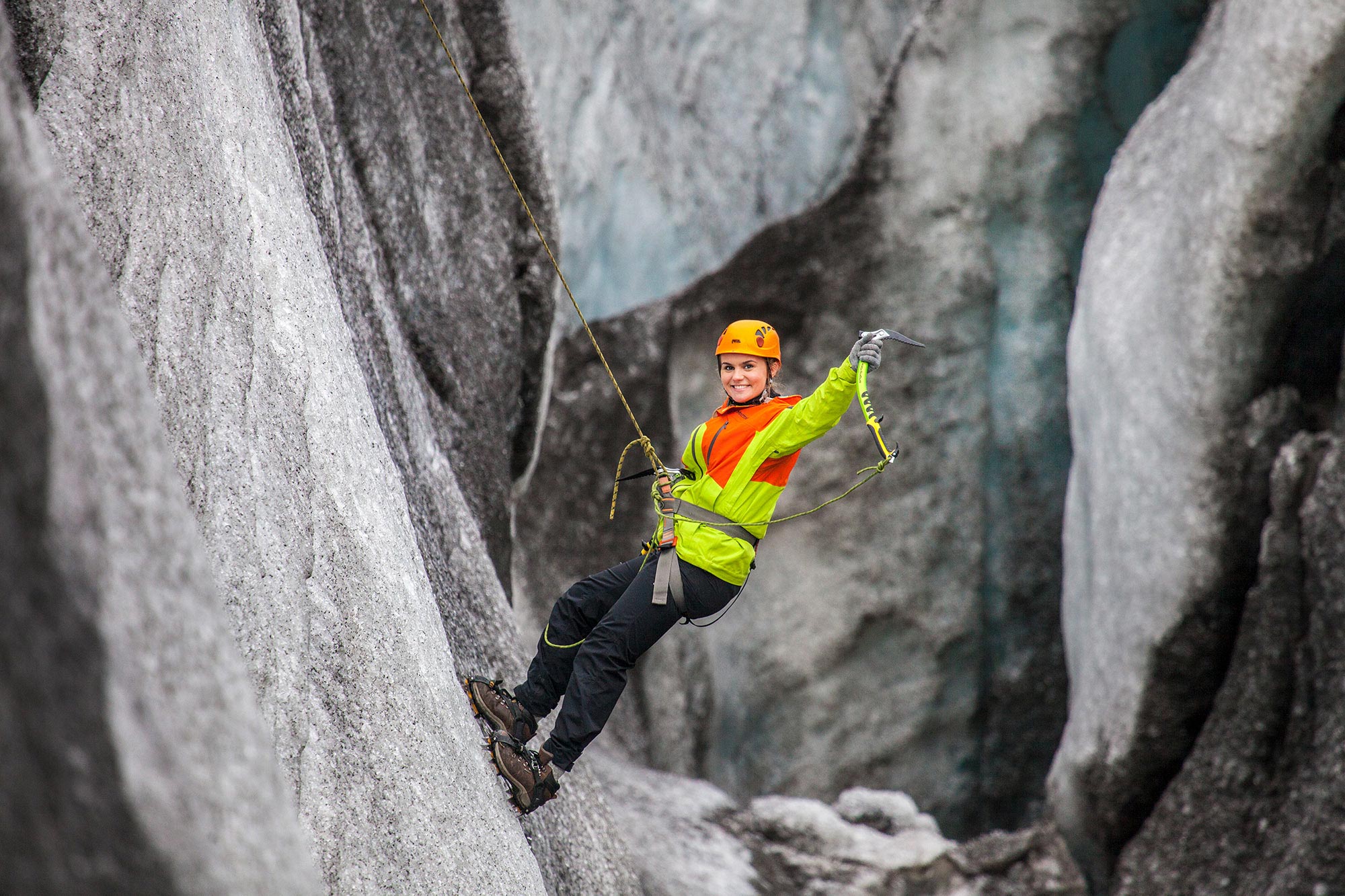 A woman ice climbing on Sólheimajökull glacier, Iceland. Photo: Bjorgvin Hilmarrson/ Icelandic Mountain Guides