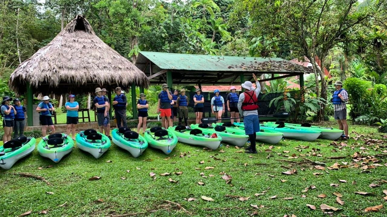 A guide in Costa Rica gives a kayak safety briefing.