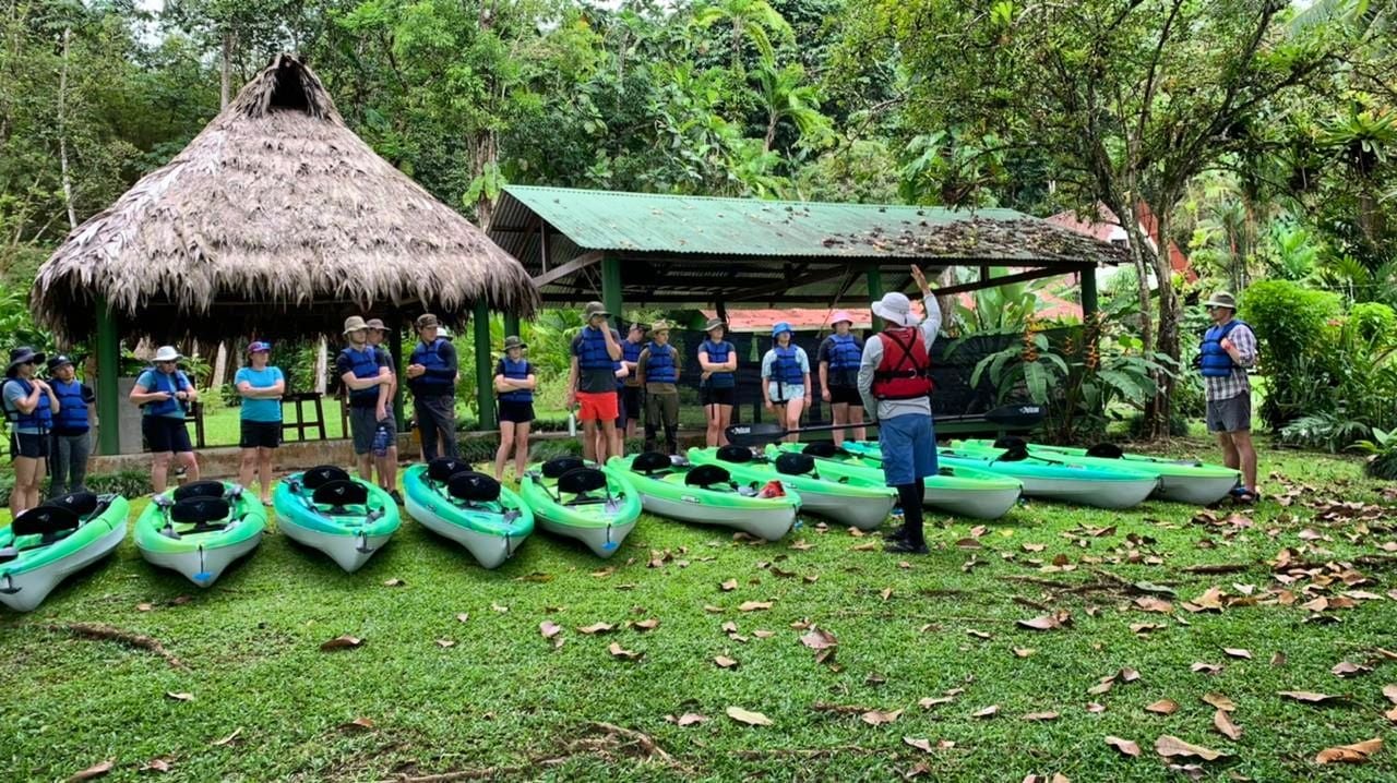 A guide in Costa Rica gives a kayak safety briefing. 