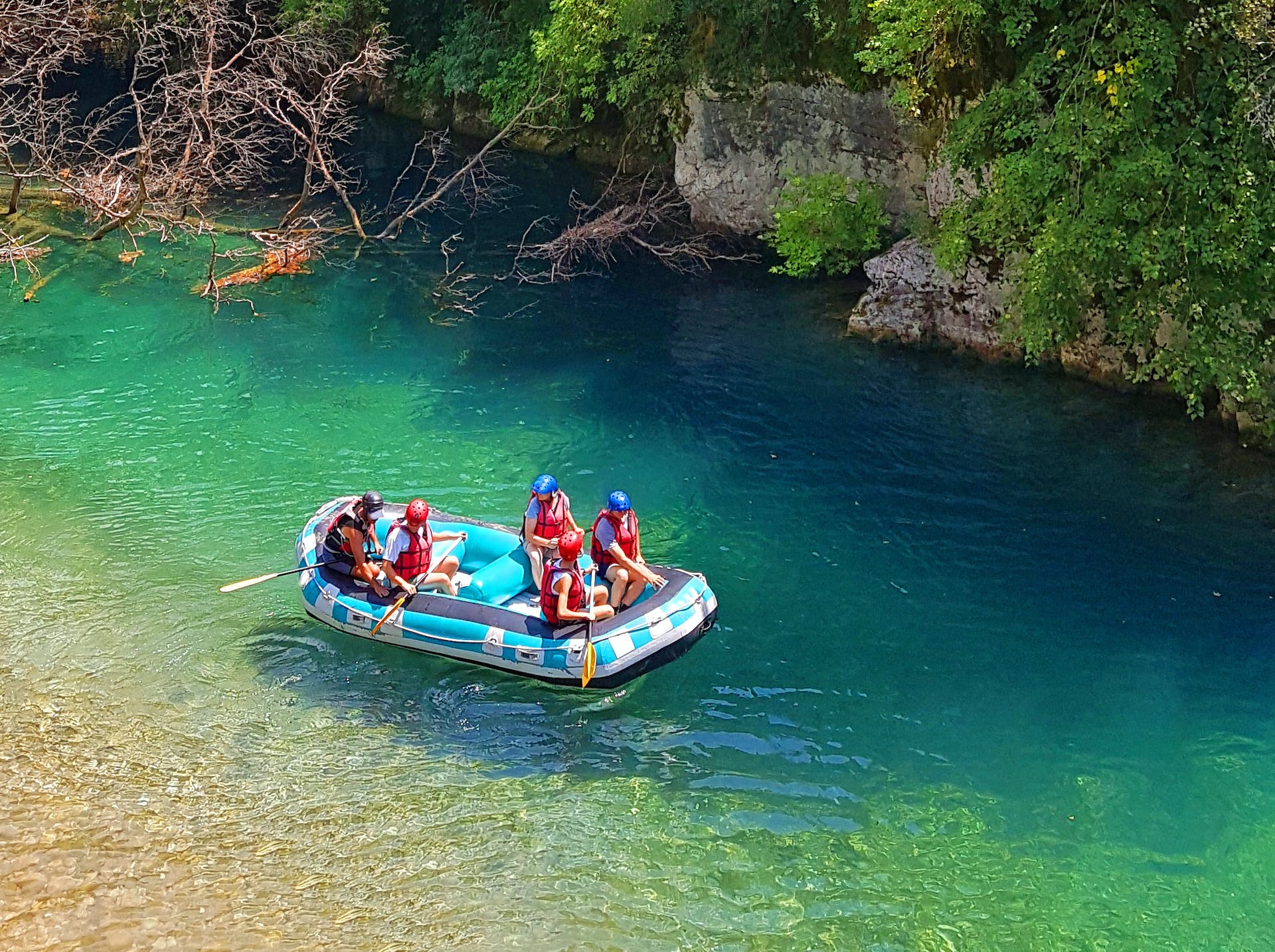 Rafting the clear waters of the Voidomatis River, in northern Greece. Photo: Getty.
