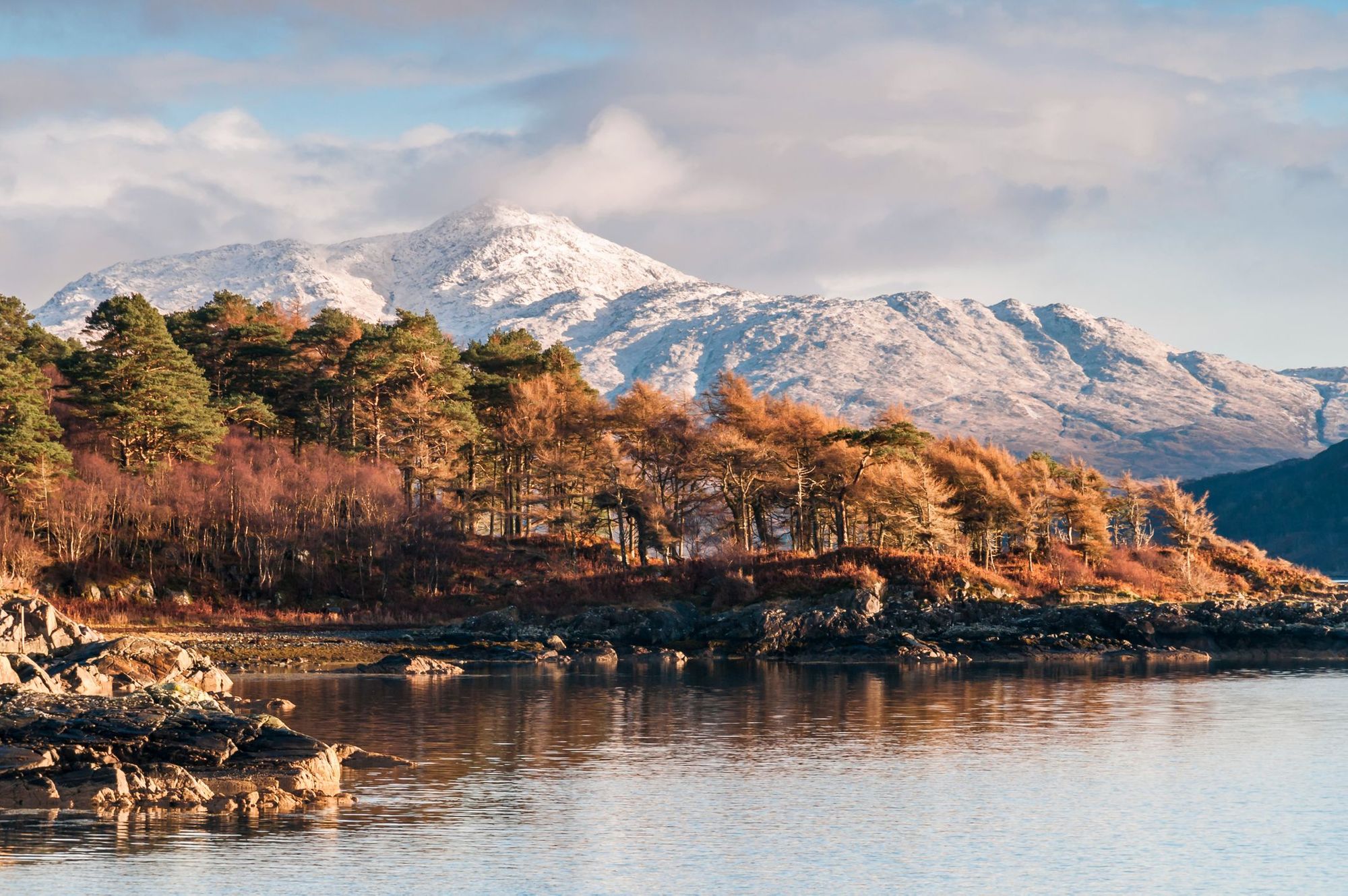 Looking North East along Loch Sunart to a snow capped Ben Resipol in the background, Ardnamurchan, Lochaber, Scotland.