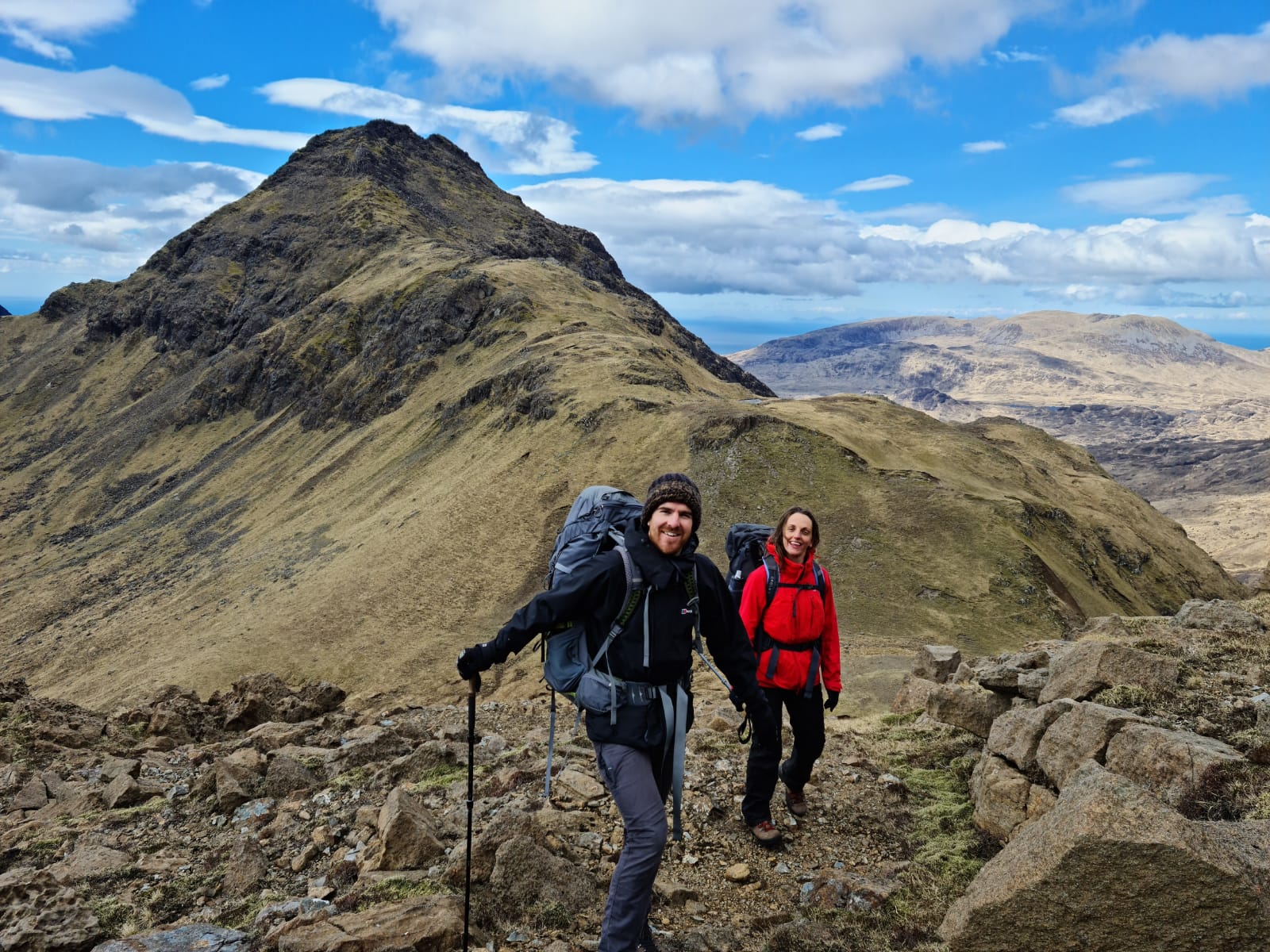 Two people hiking on Rùm. Photo: Atlas Mountaineering.