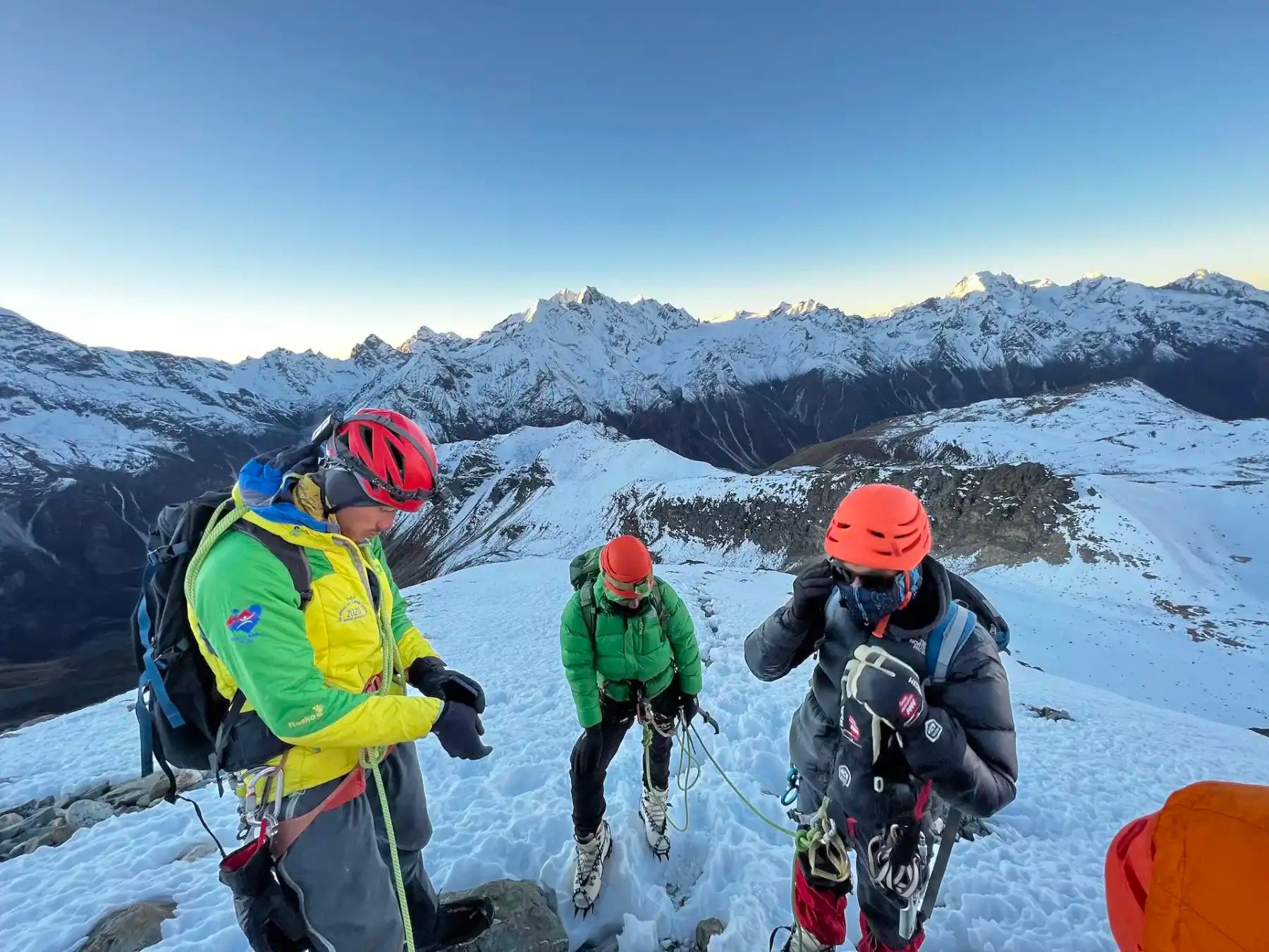 A Nepalese guide prepares to take two trekkers up Yala Peak. Photo: Much Better Adventures.