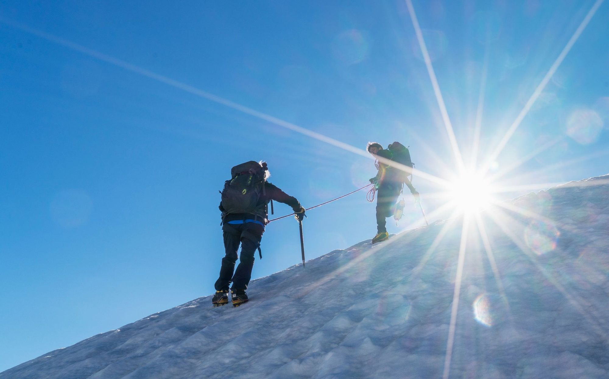 A guide helps a climber up Mont Blanc. Photo: Getty.