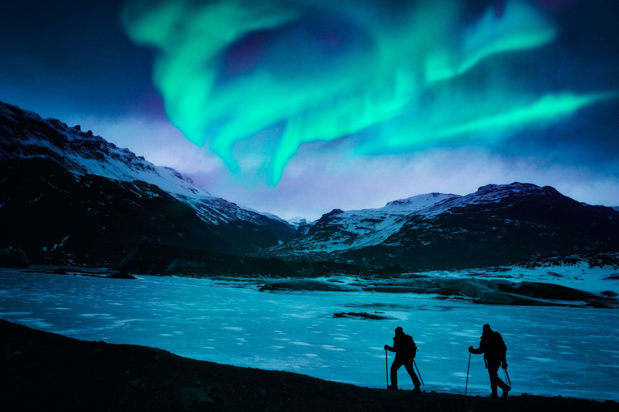 Chasing the Northern Lights on a hike in Iceland. Photo: Getty.