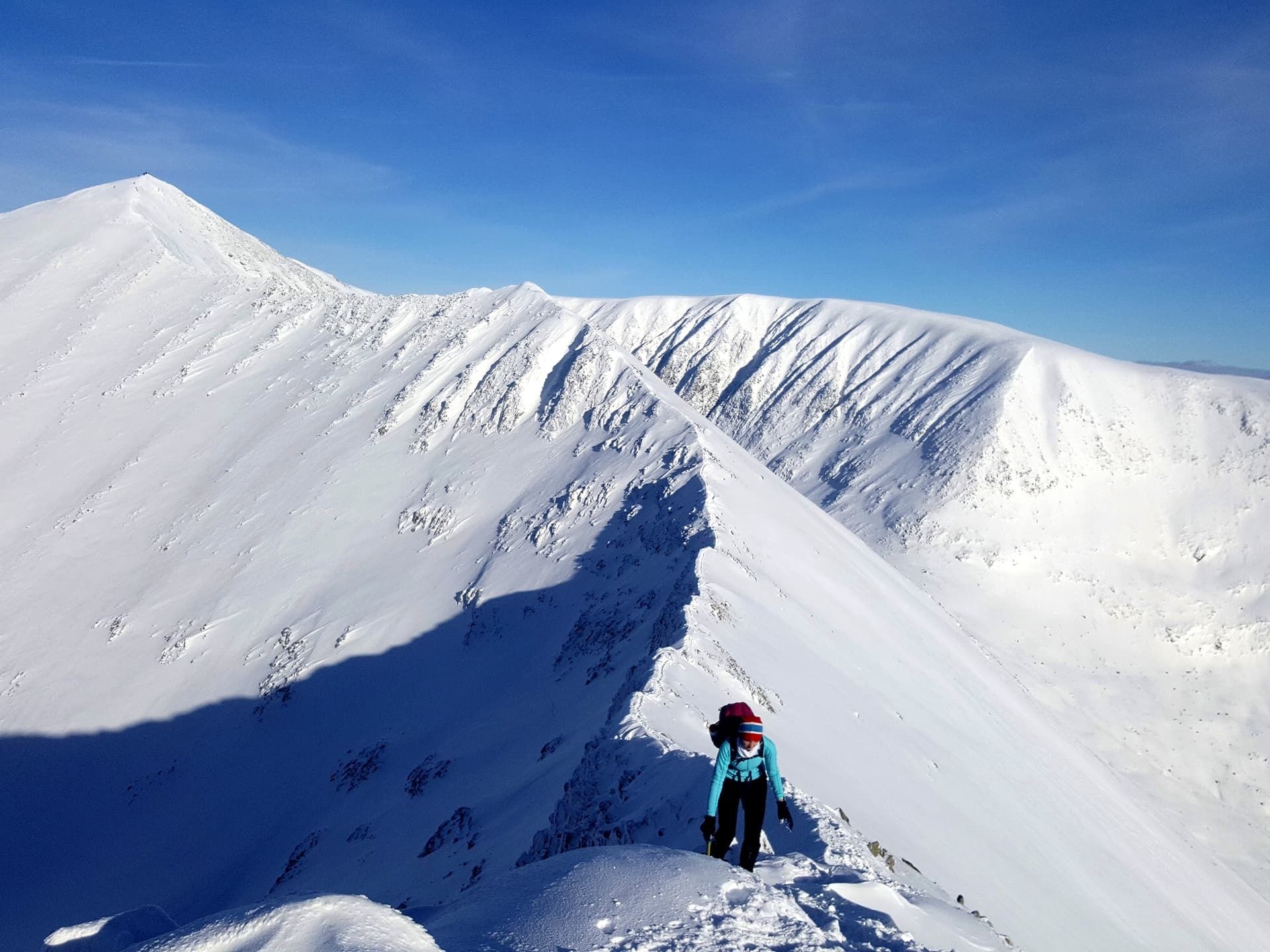 A climber making a winter ascent of Ben Nevis, along the CMD arête. Photo: Atlas Mountaineering.