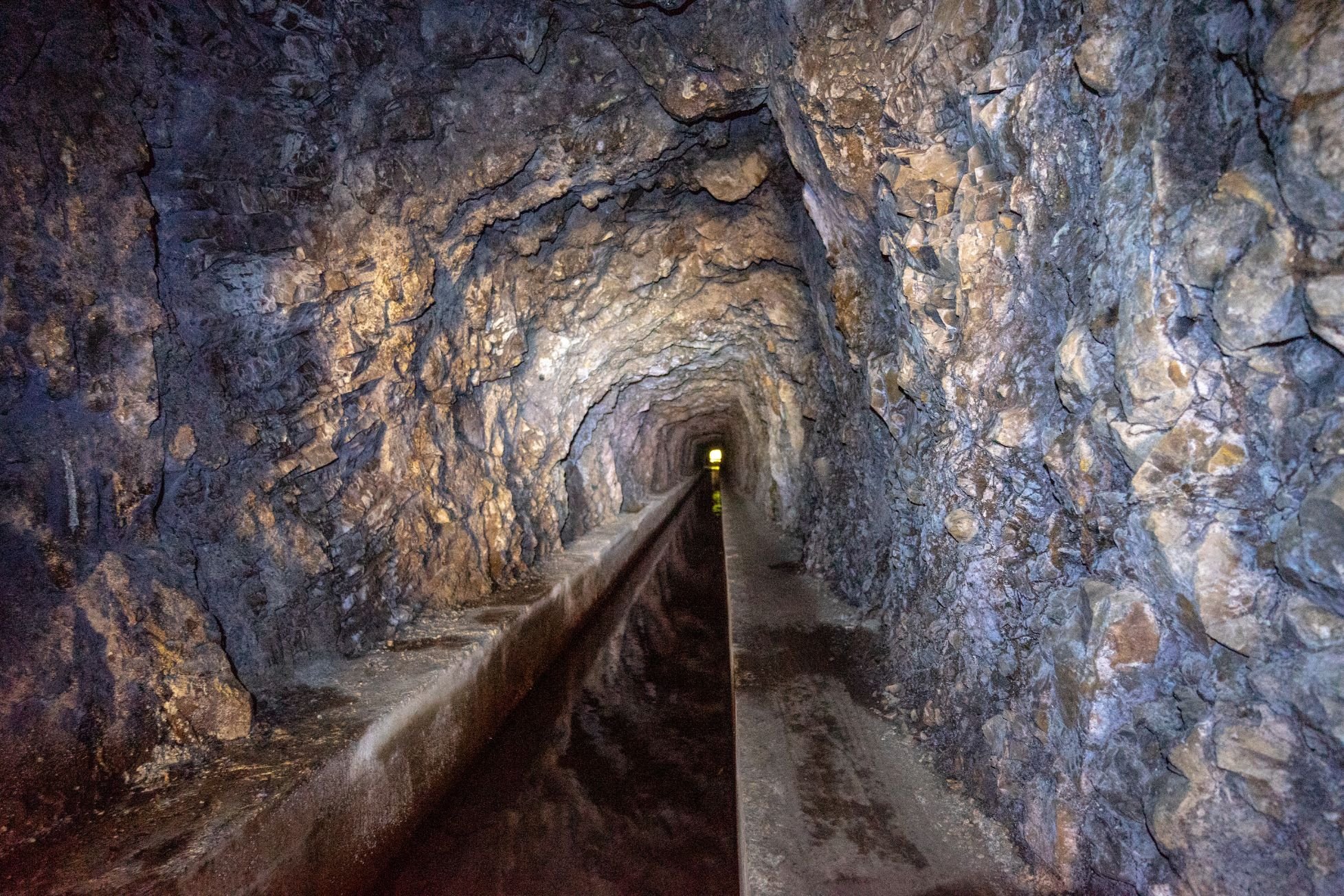 A rocky tunnel on the Levada Fajã do Rodrigues, in Madeira. Photo: Getty