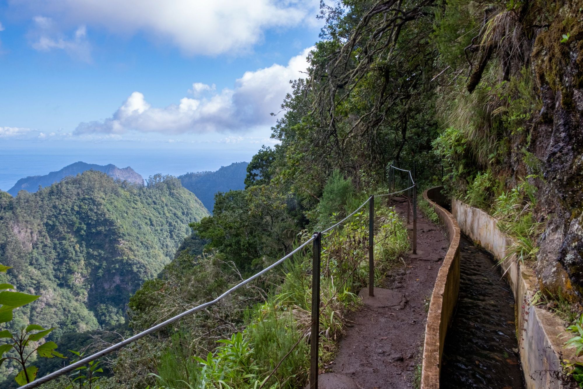 The Levada do Caldeirão Verde walk, one of the best levada walks in Madeira, sneaks along a mountain. Photo: Getty