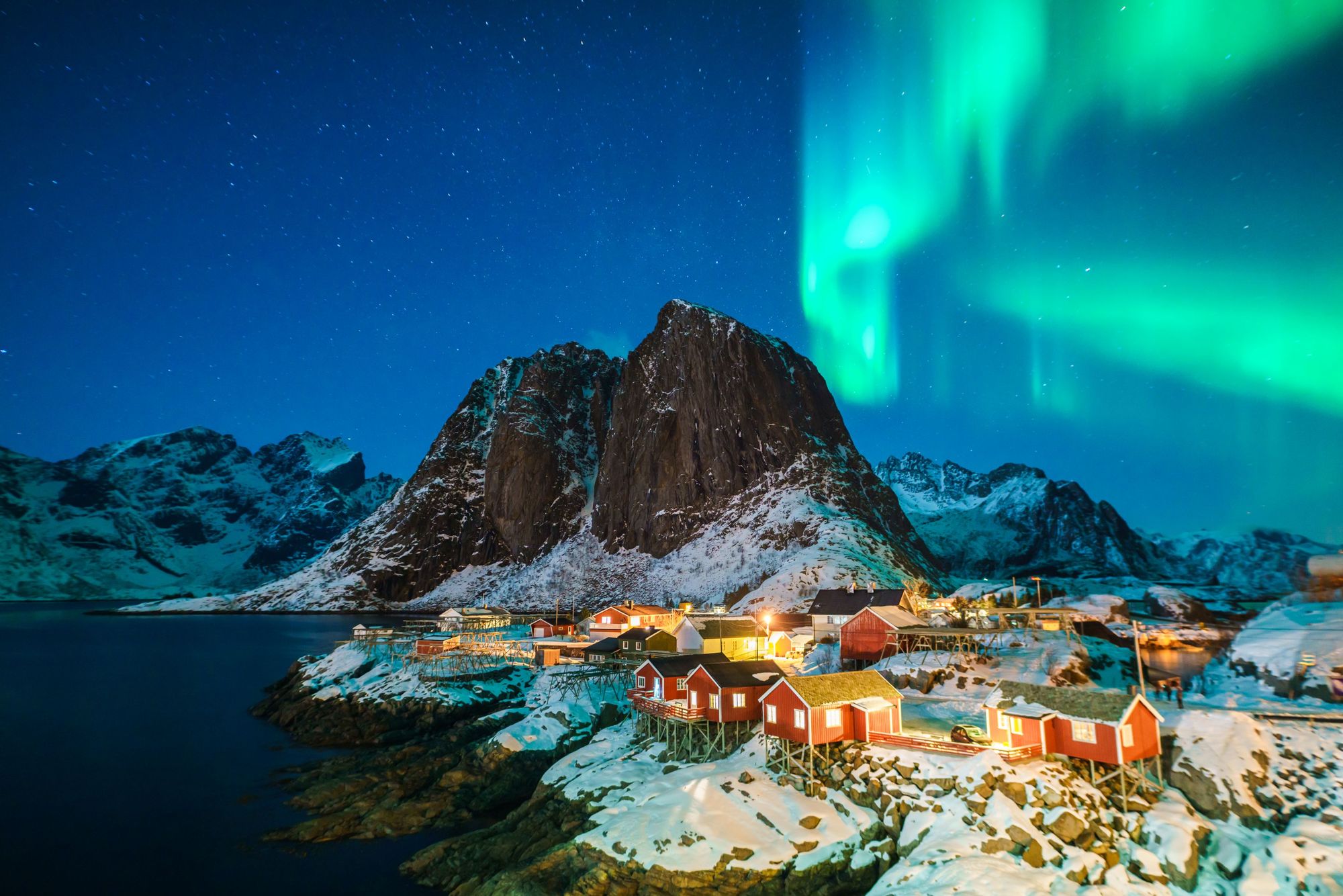 The northern lights in the sky behind the Lofoten Islands, in the north of Norway. Photo: Getty