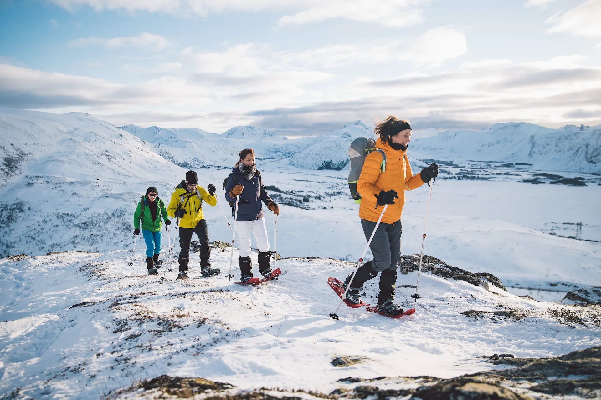 Hikers with snowshoes and poles on their way to Justadtinden, Lofoten. Photo: Northern Explorer.