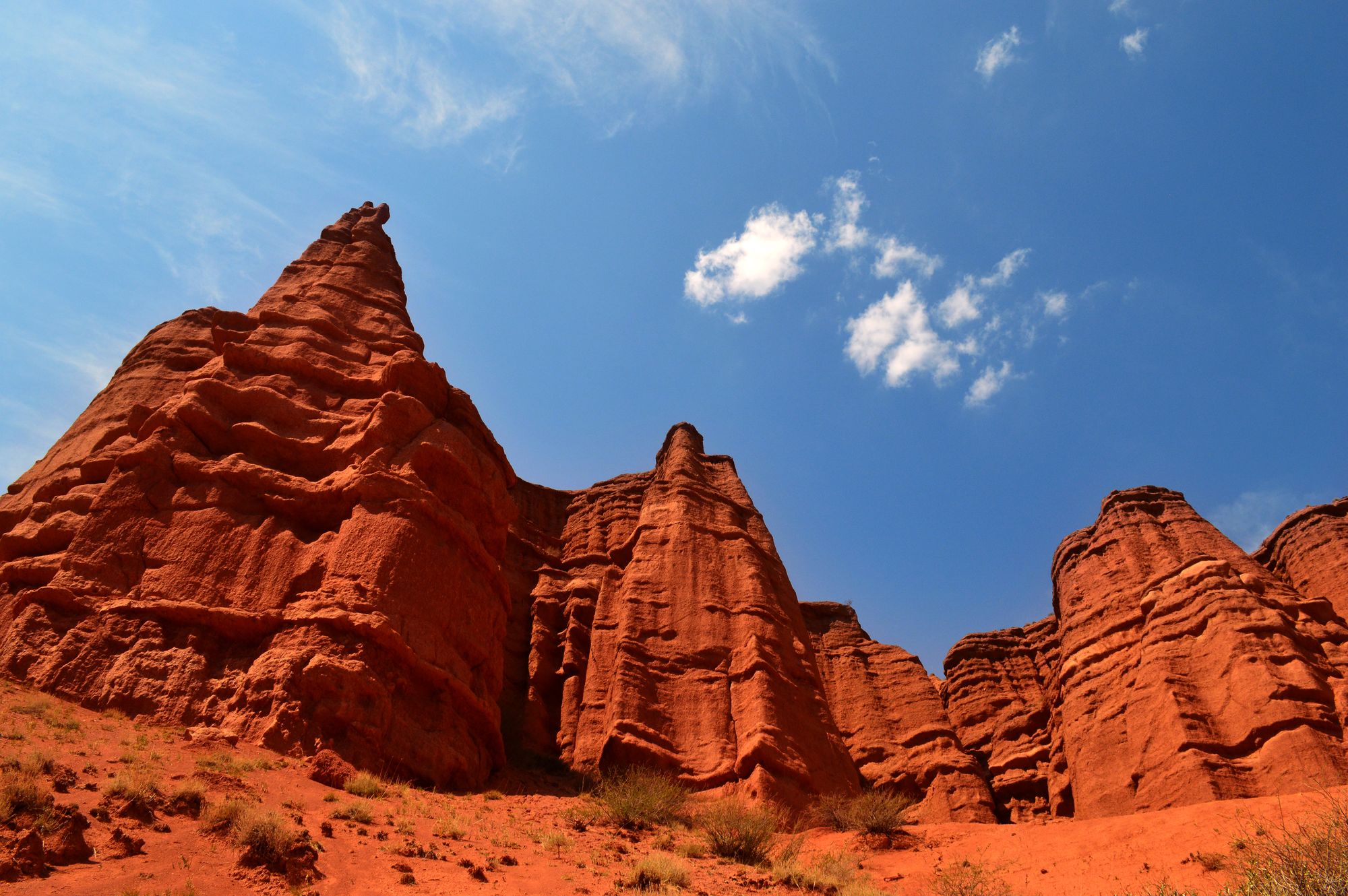 Dramatic red sandstone rock formations in Kyrgyzstan.