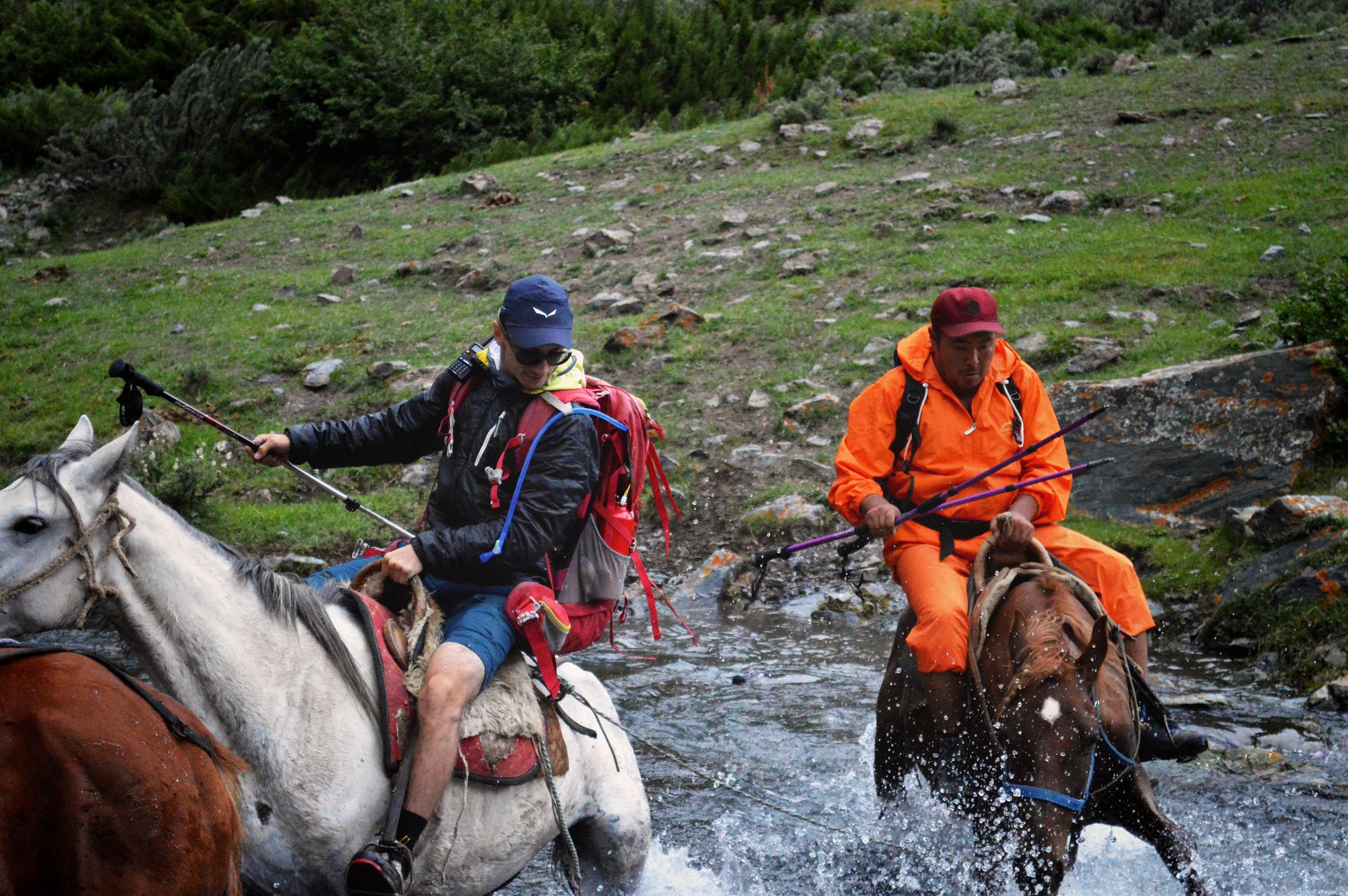 Crossing a lake on horseback in Kyrgyzstan.