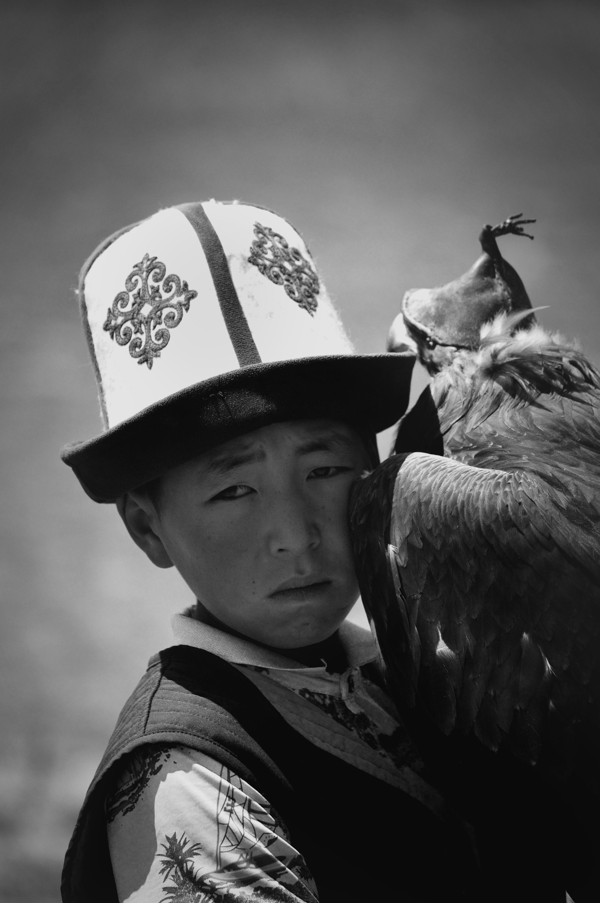 Kyrgyz boy and his hunting eagle.