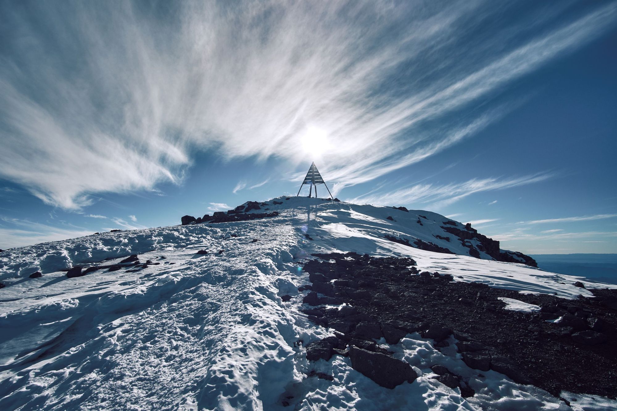 The iconic metal trigonometric pyramid at the top of Mount Toubkal, which looks out over all of North Africa. Photo: Getty