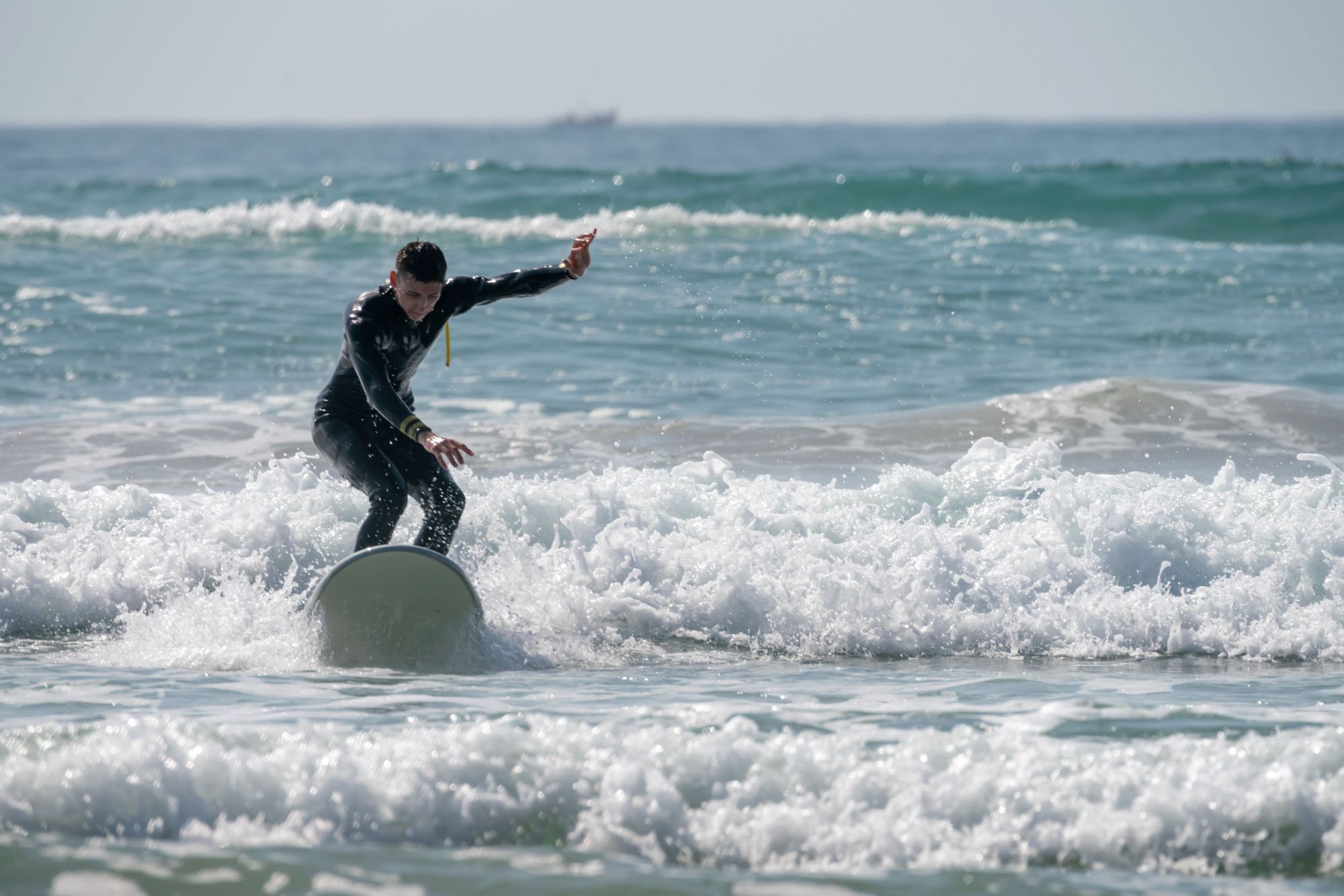 A tourist learns to surf on the waves of Taghazout, on the Atlantic Coast of Morocco. Photo: Getty