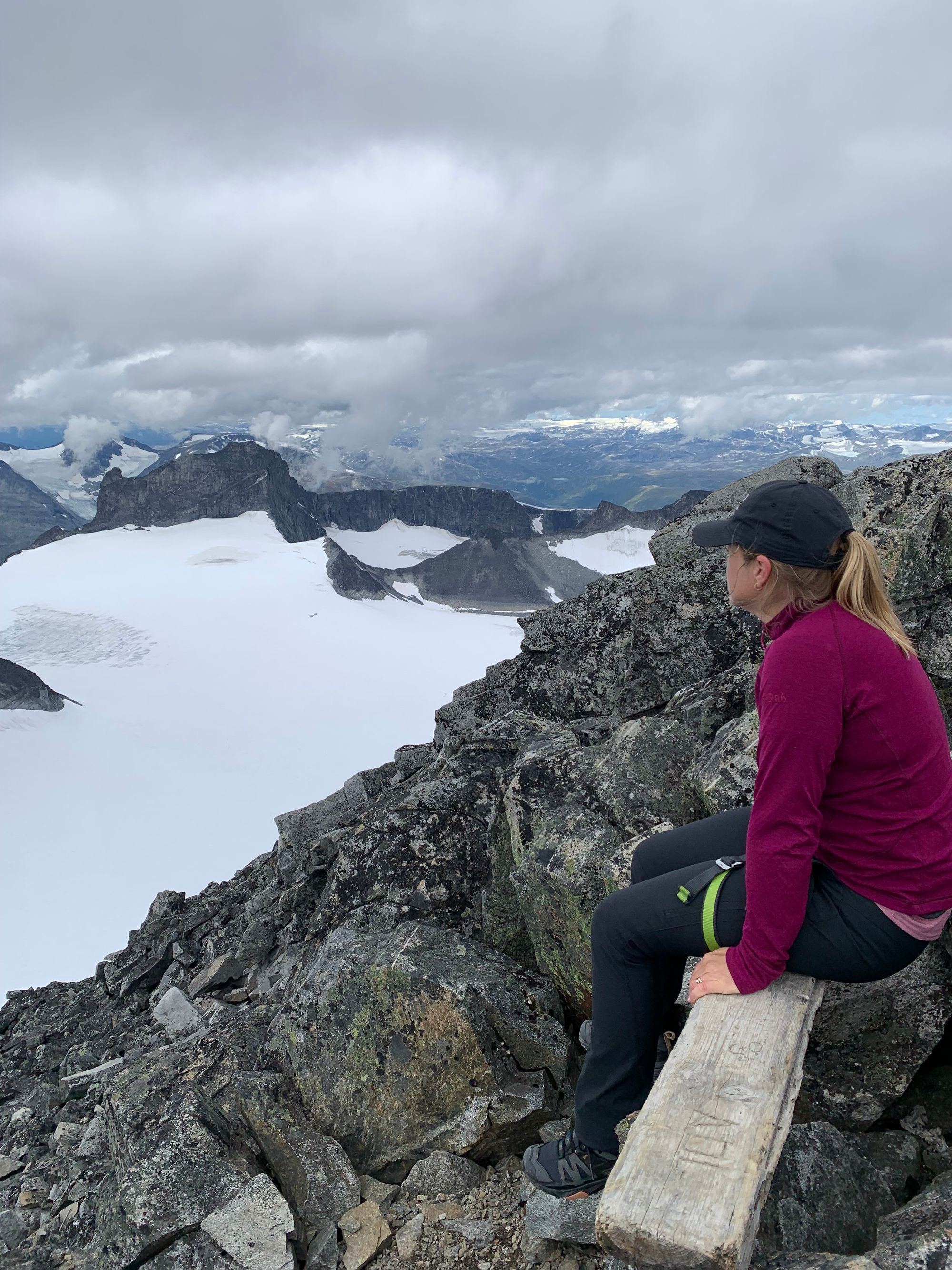 Female hiker at the top of Galdhøpiggen, Norway.