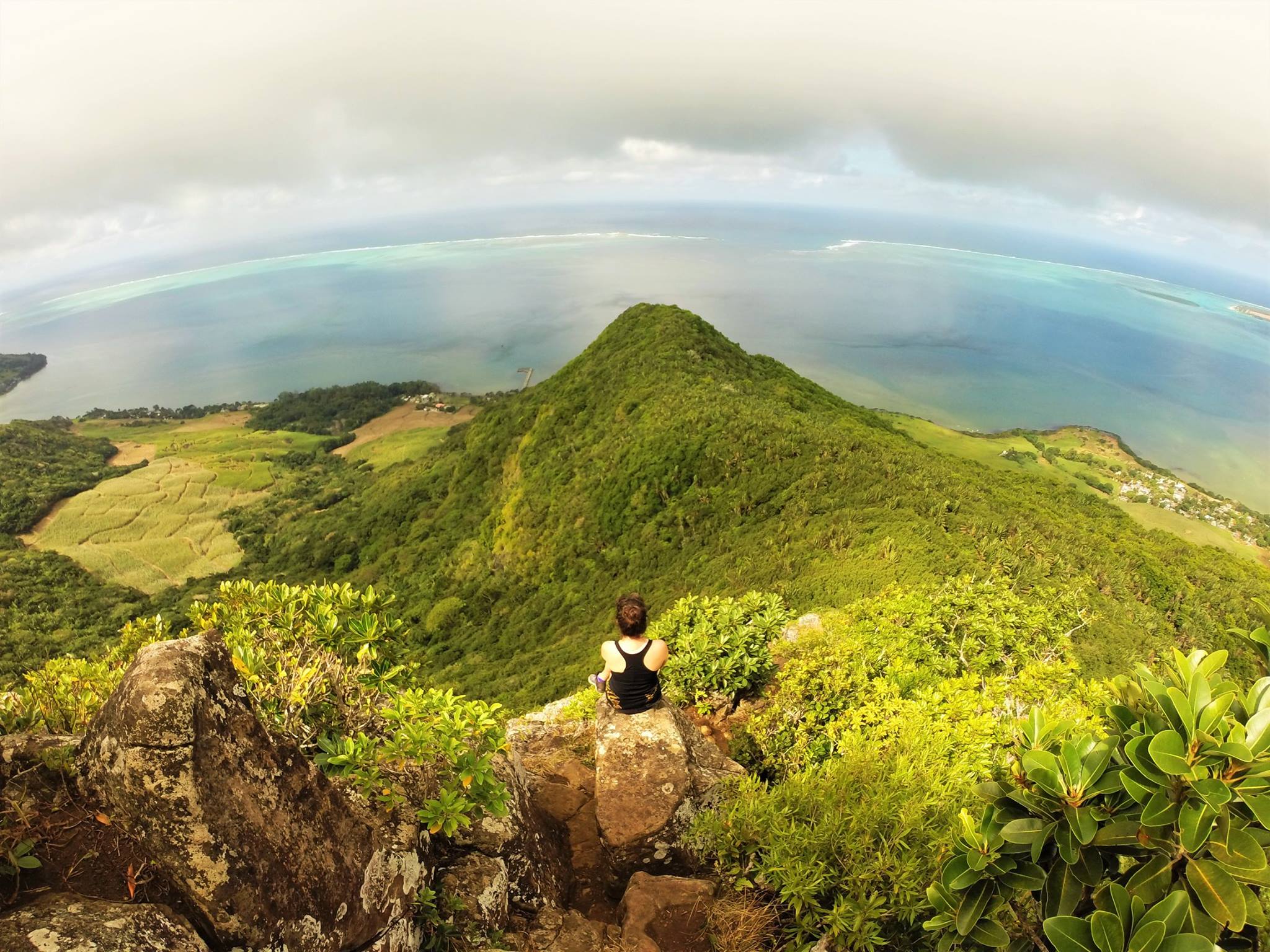 A woman poses at a viewpoint on the Morne Peninsula, Mauritius. Photo: Mauritius Conscious.