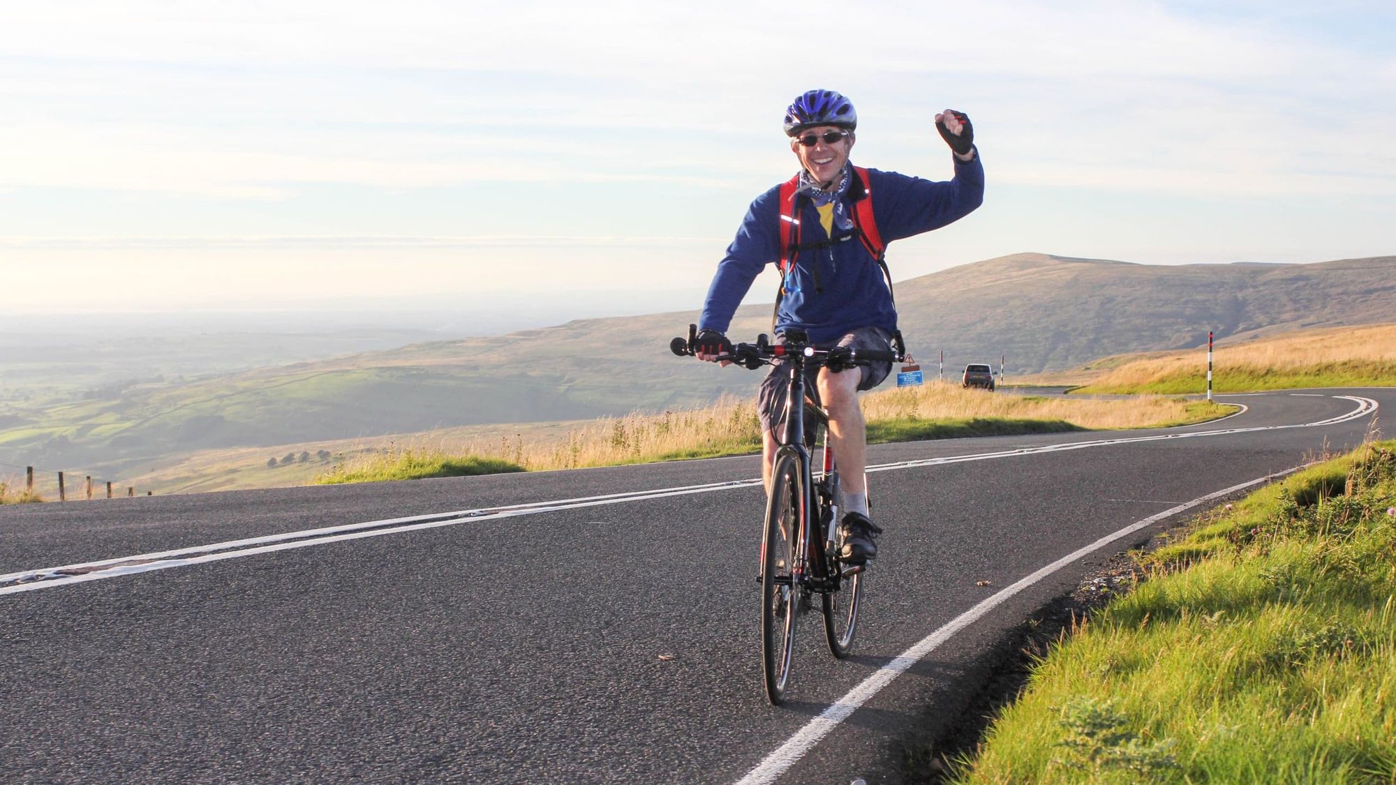 A cyclist on a mountain road in Snowdonia National Park. Photo: Getty.