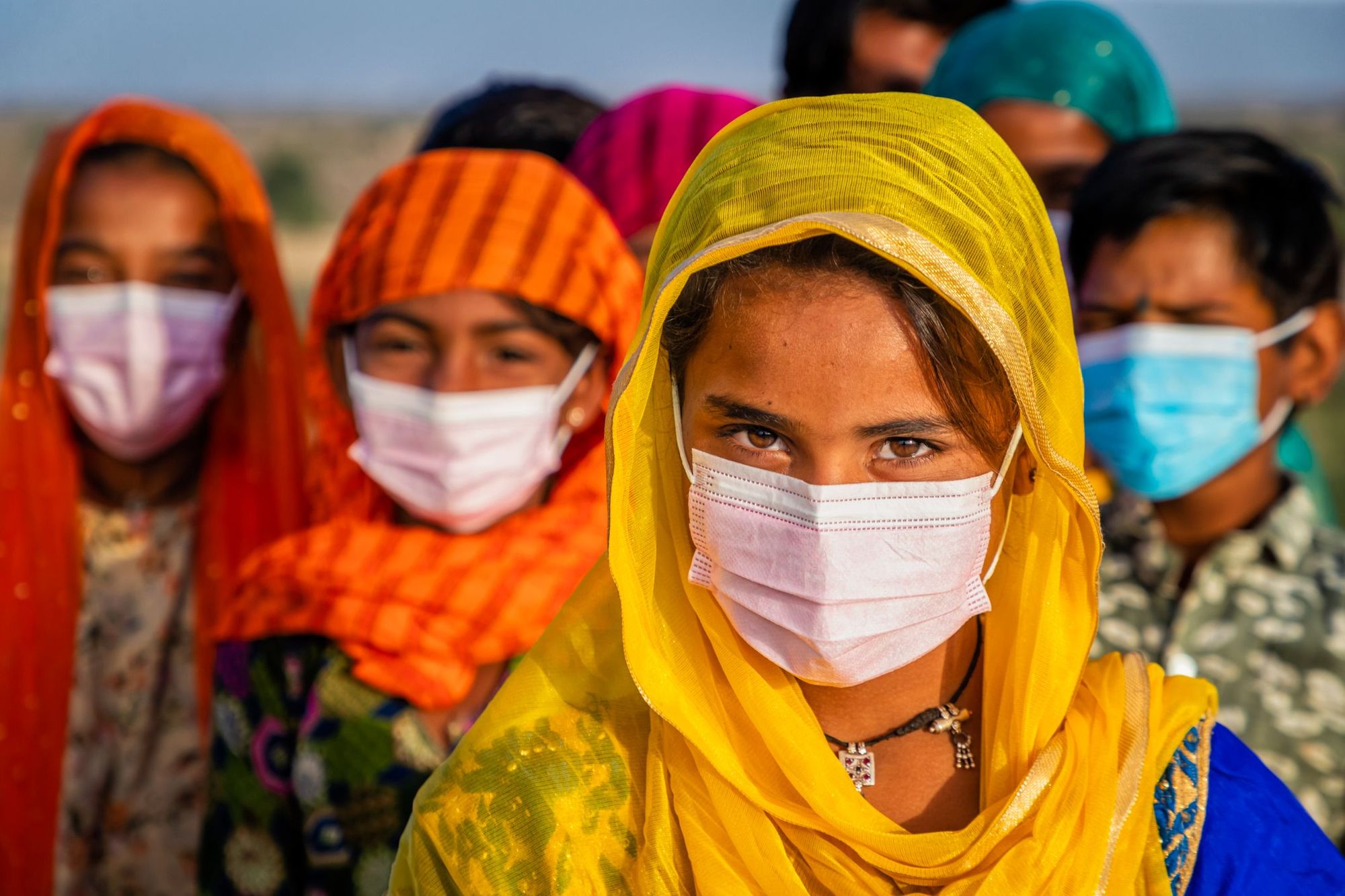 Villagers from Rajasthan wearing face masks.