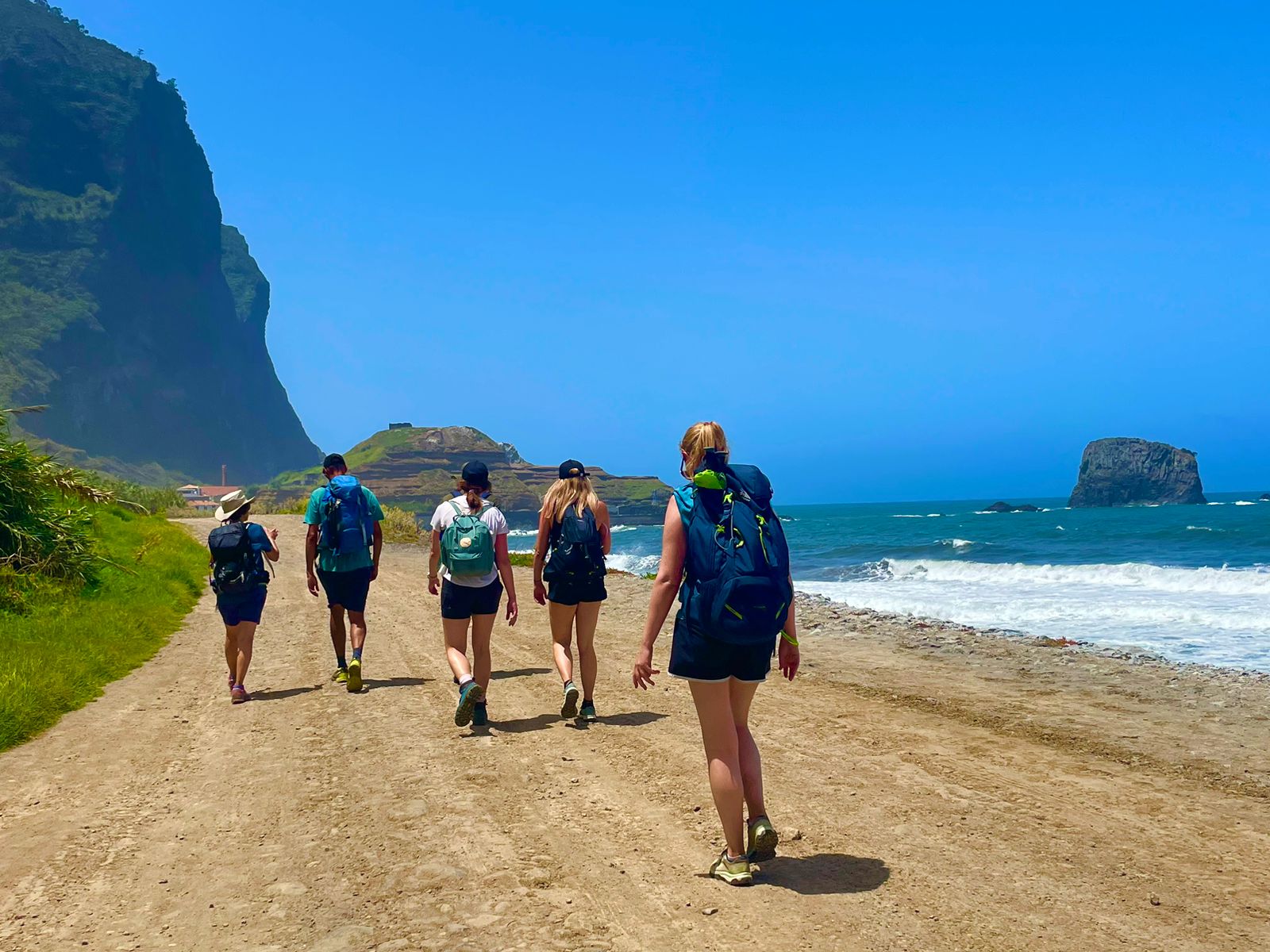 Hikers on the beach next to the ocean, Madeira