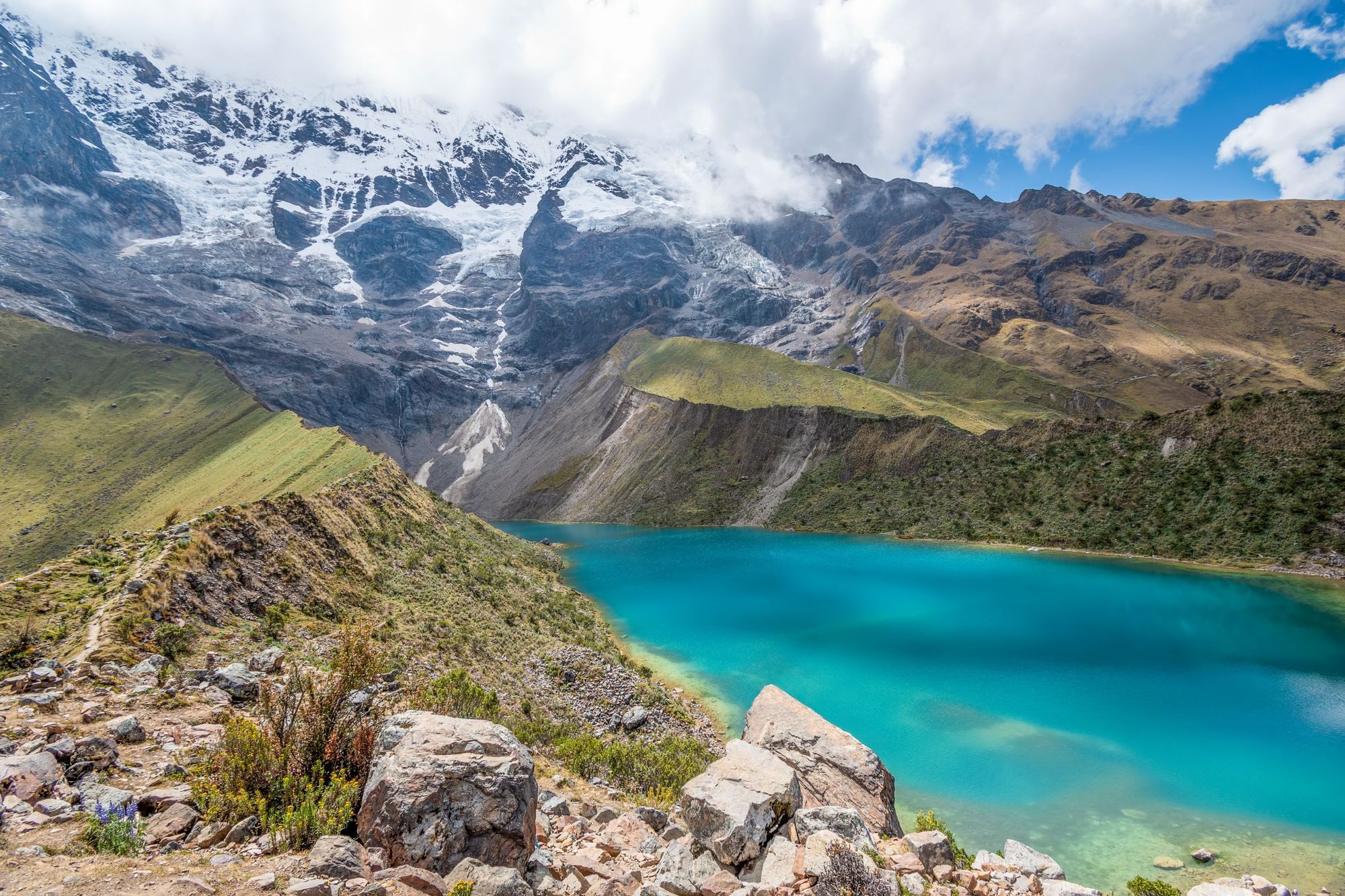 The turquoise colours of Humanatay Lake, sitting below the glacier on the Salkantay Trek. Photo: Getty