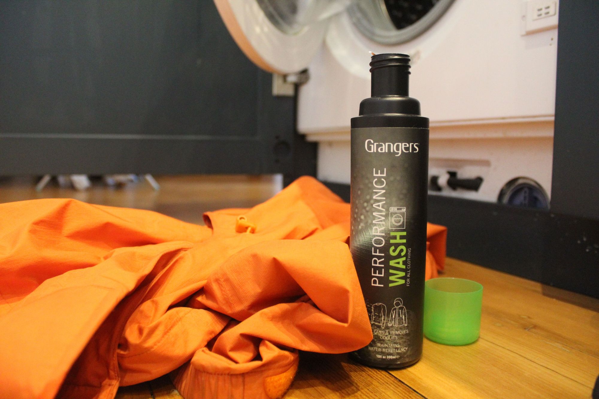Reproofing a jacket using Granger's performance wash. Photo: Stuart Kenny