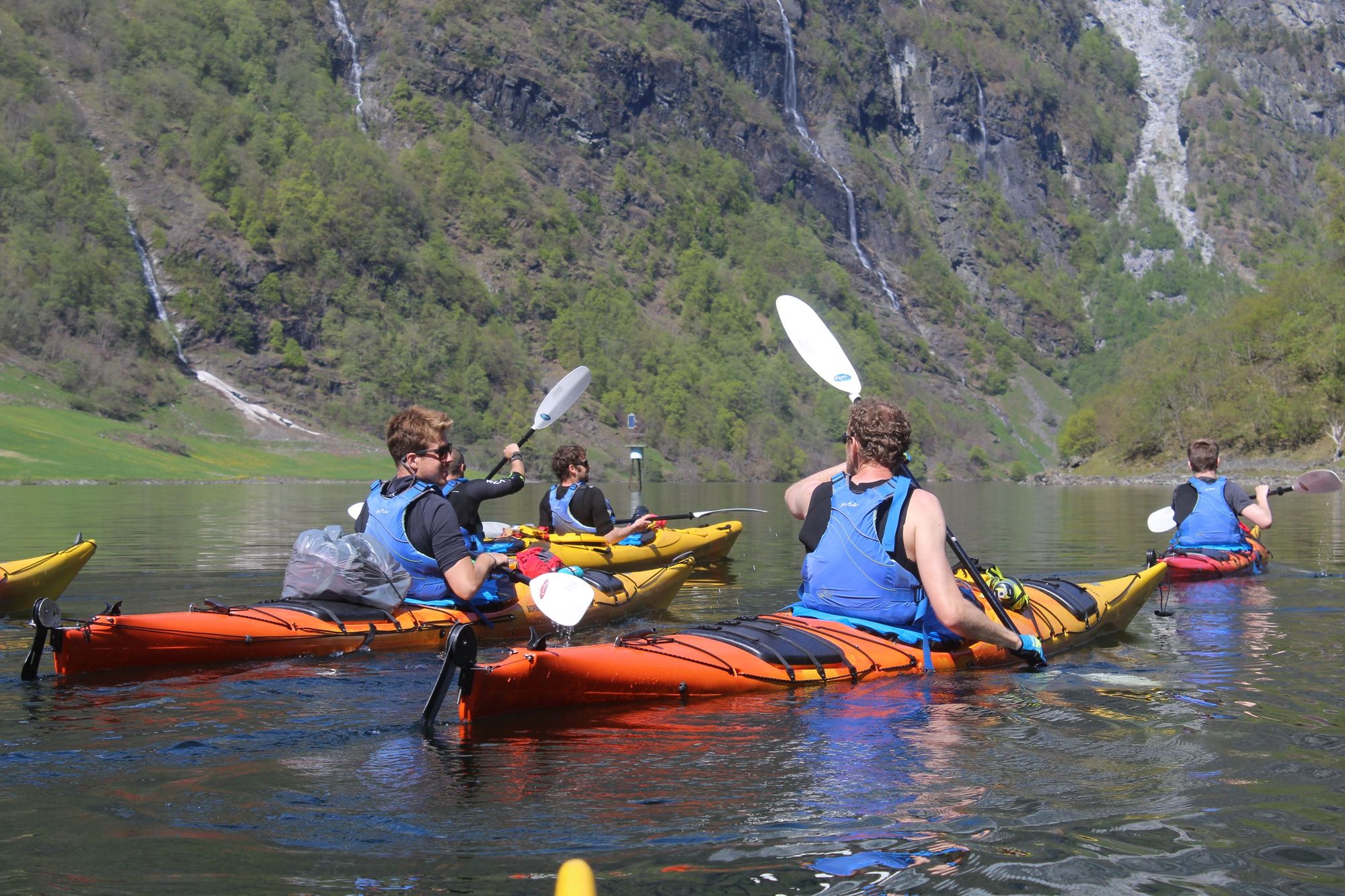 An old boat on the edge of the Nærøyfjord, with a waterfall behind. Photo: Getty