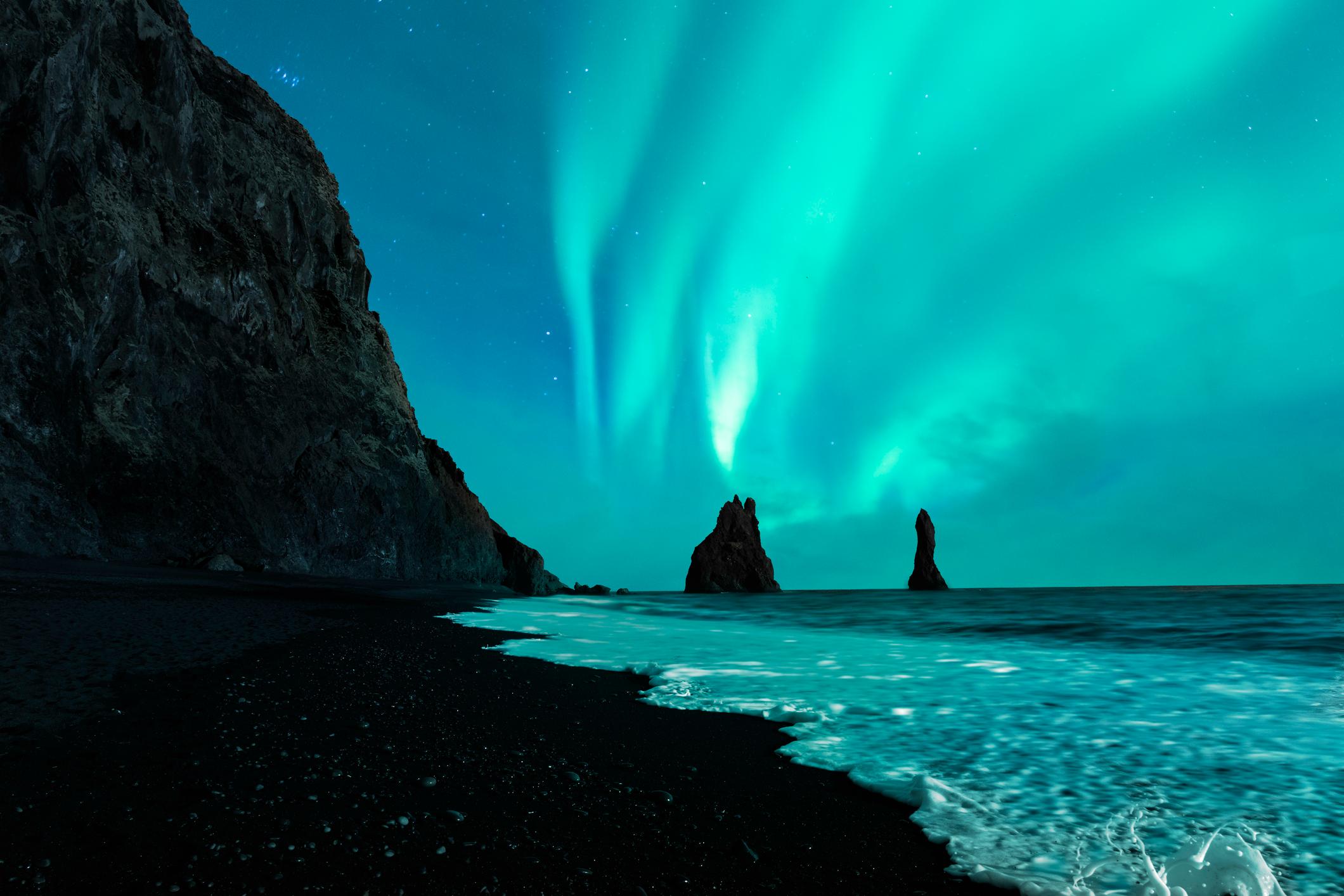 The northern lights on Vik Beach. Photo: Getty.