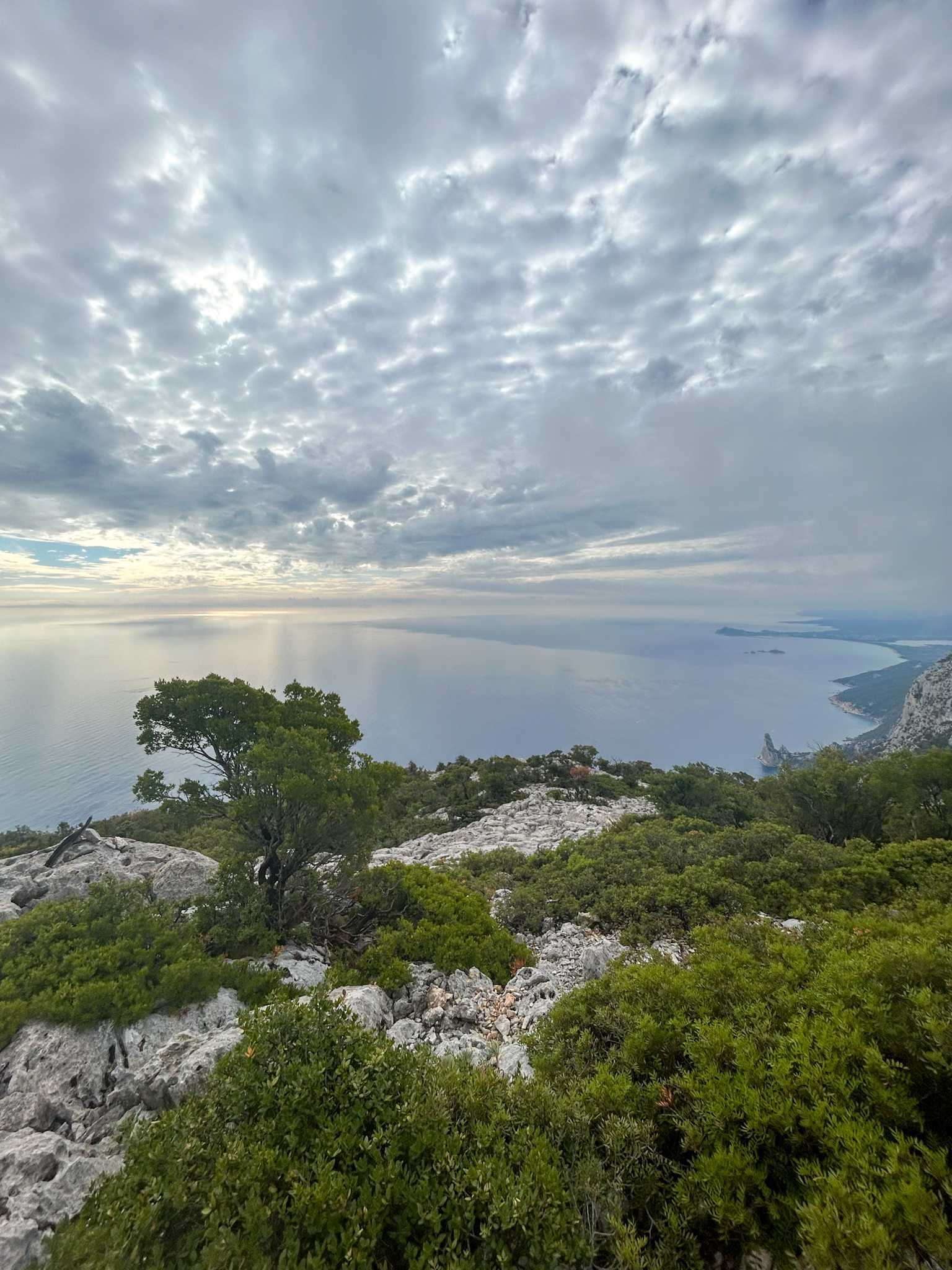 Dramatic clouds over the coastline of Sardinia, viewed from the clifftop.