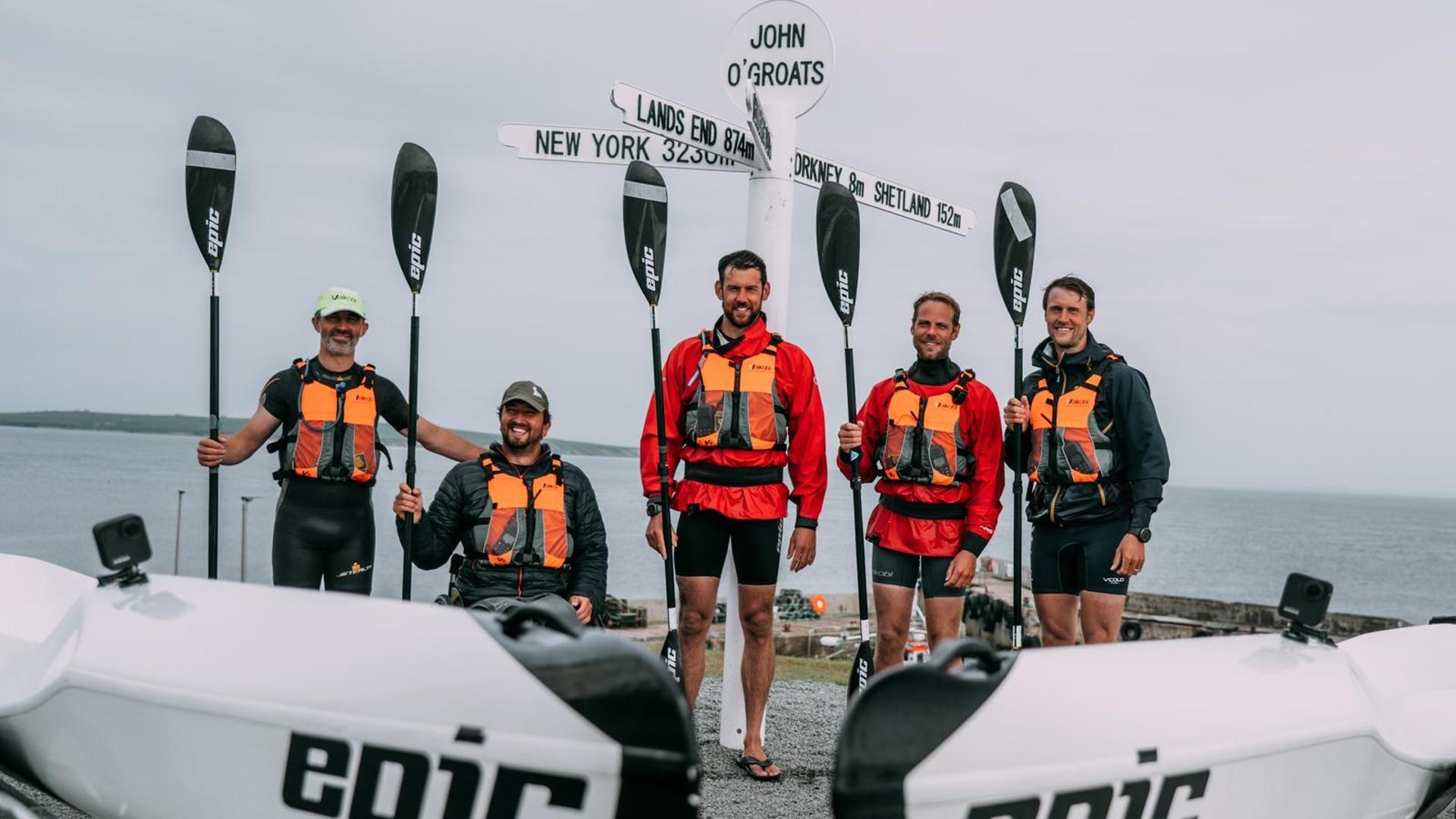 Darren Edwards and team celebrating reaching the end of their Land's End to John o' Groats challenge. Photo: Darren Edwards