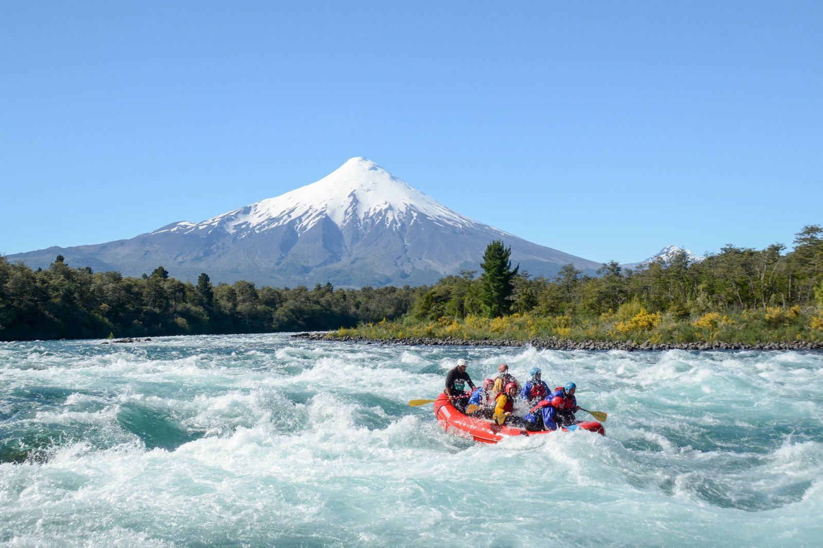 White water rafting near Puerto Varas, looking onto the mighty Osorno volcano. Photo: Birds Chile