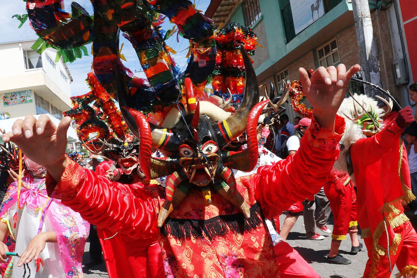 A participant in Ecuador's Diablada de Píllaro festival, wearing a red devil costume: Wikimedia Commons.