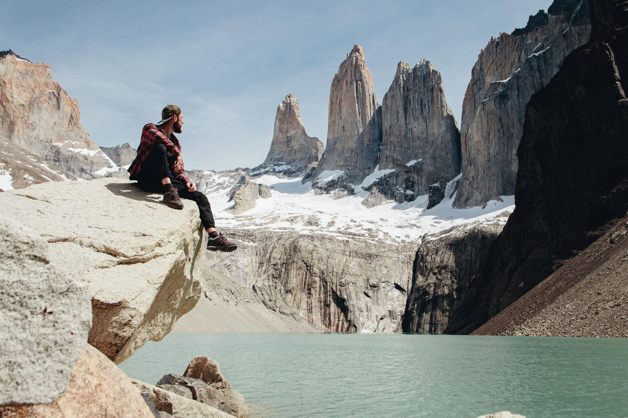 A solo traveller at the base of the famous towers which give Torres del Paine its name. Photo: Getty