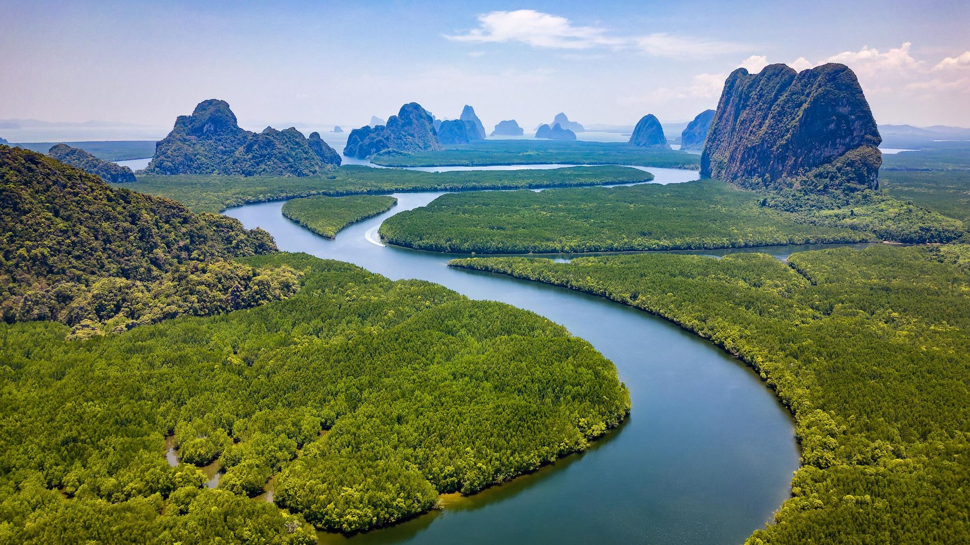 A huge mangrove forest and the towering limestone pinnacles of Phang Nga Bay, Thailand. Photo: Getty