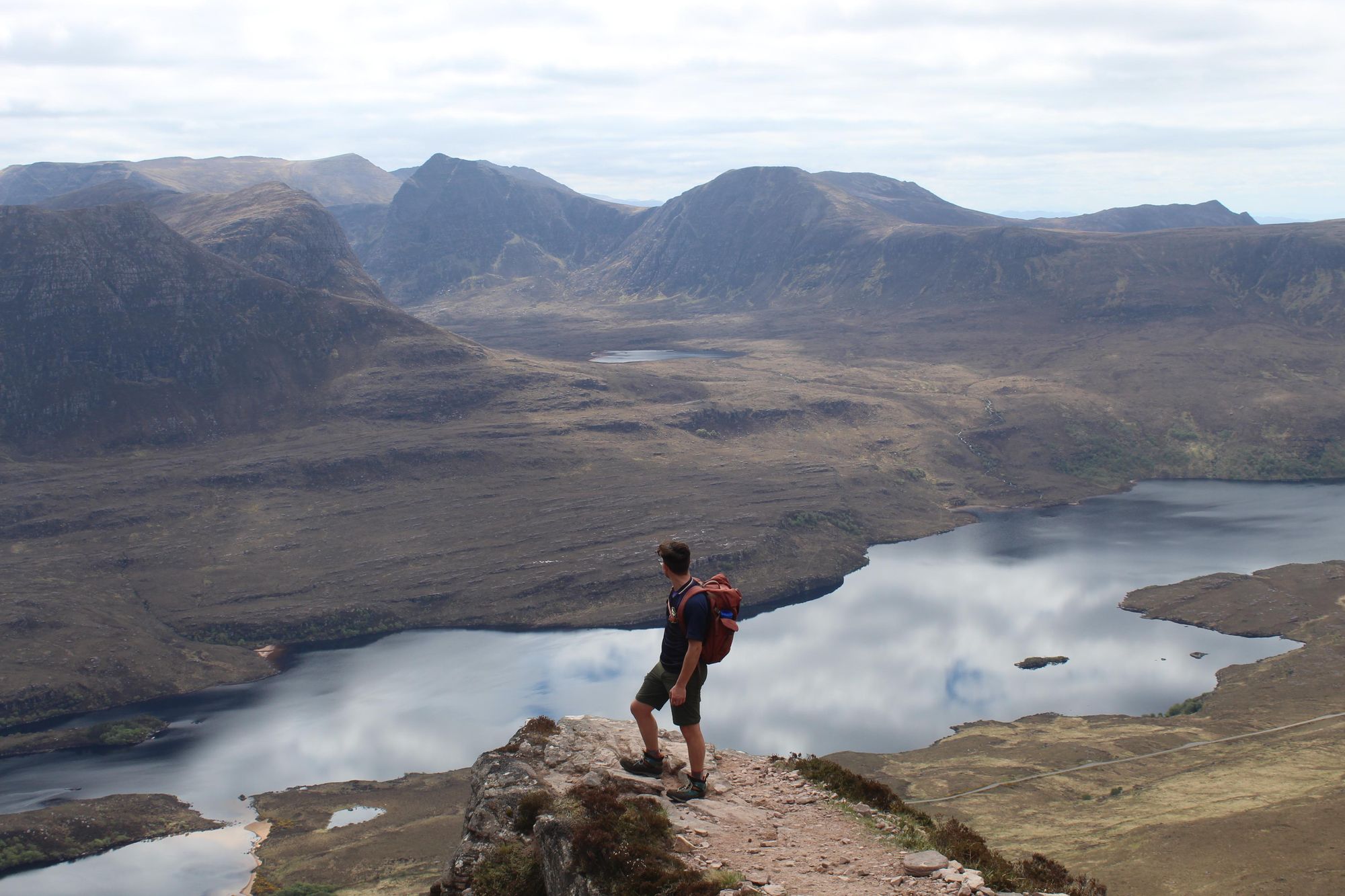 The author of the article atop Stac Pollaidh, looking out on one of the great Scottish landscapes. Photo: Stuart Kenny