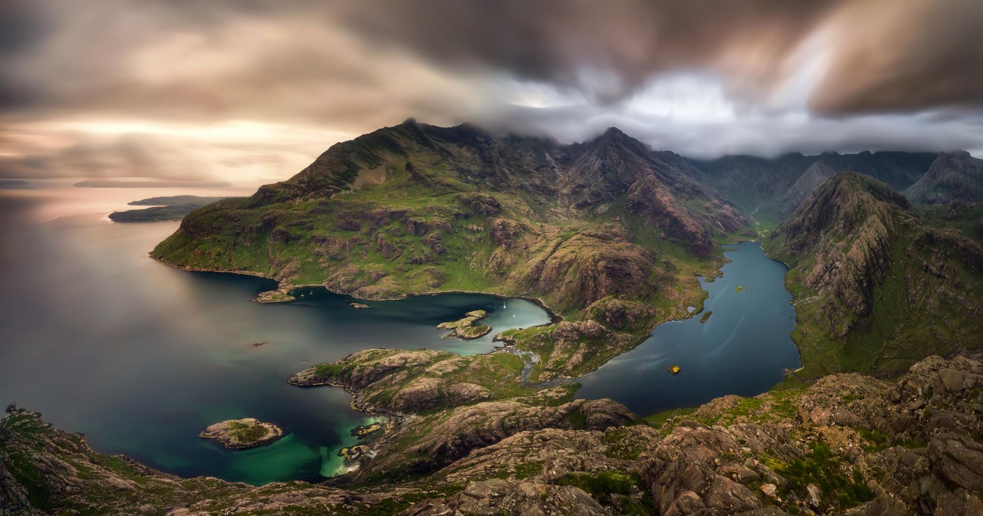 The remarkable view from the summit of Sgùrr na Strì, looking down on Loch Coruisk and the sea. Photo: Getty