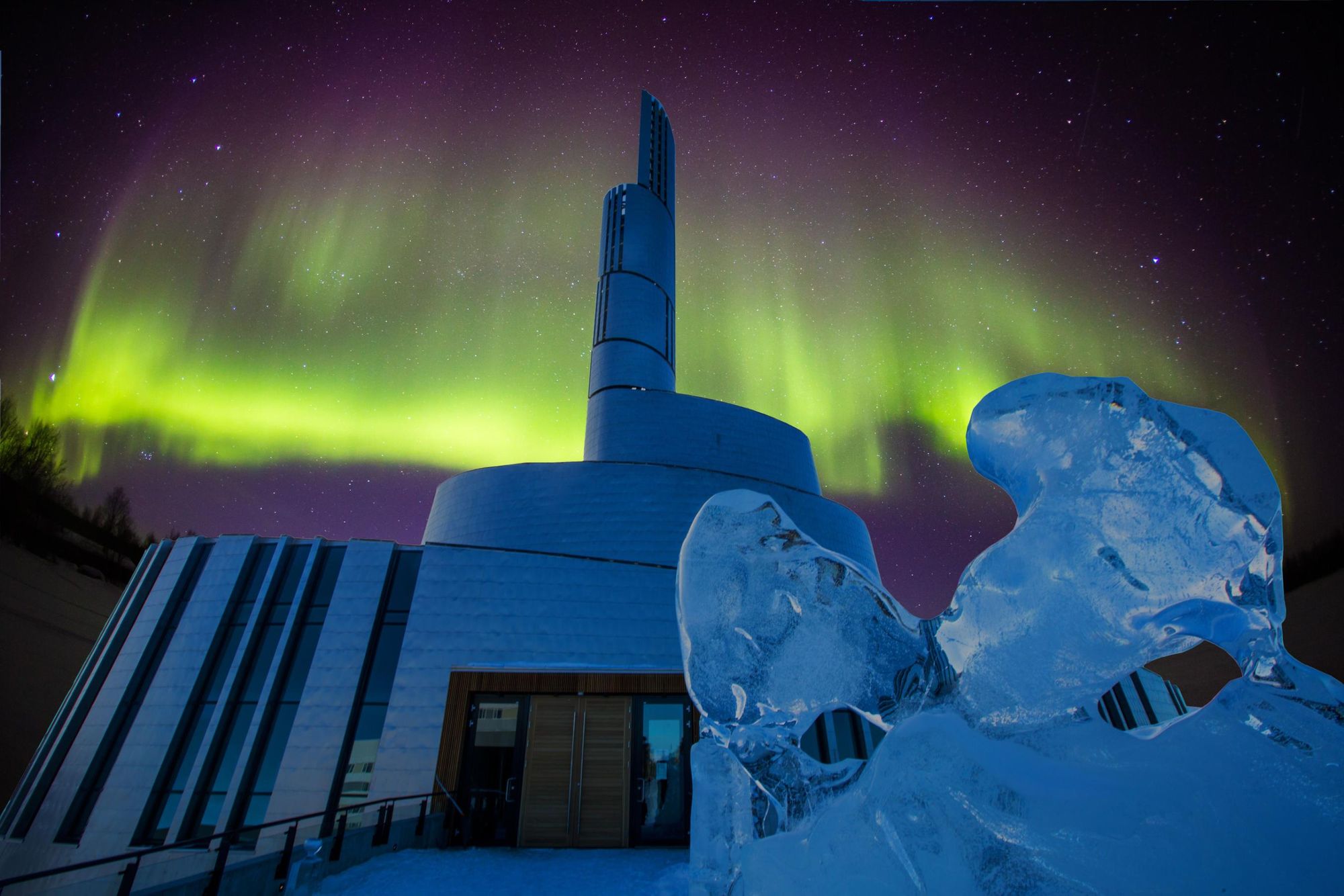 The aurora blazes above the Northern Lights Cathedral in Alta, Norway. Photo: Canva.