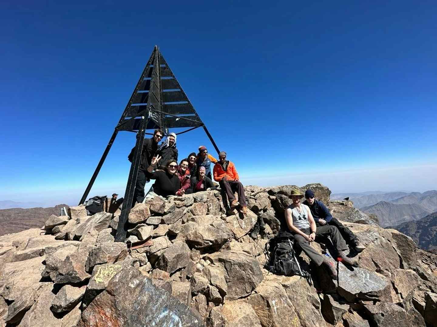 Hikers celebrate on the summit of Mount Toubkal. Photo: Aztat Treks