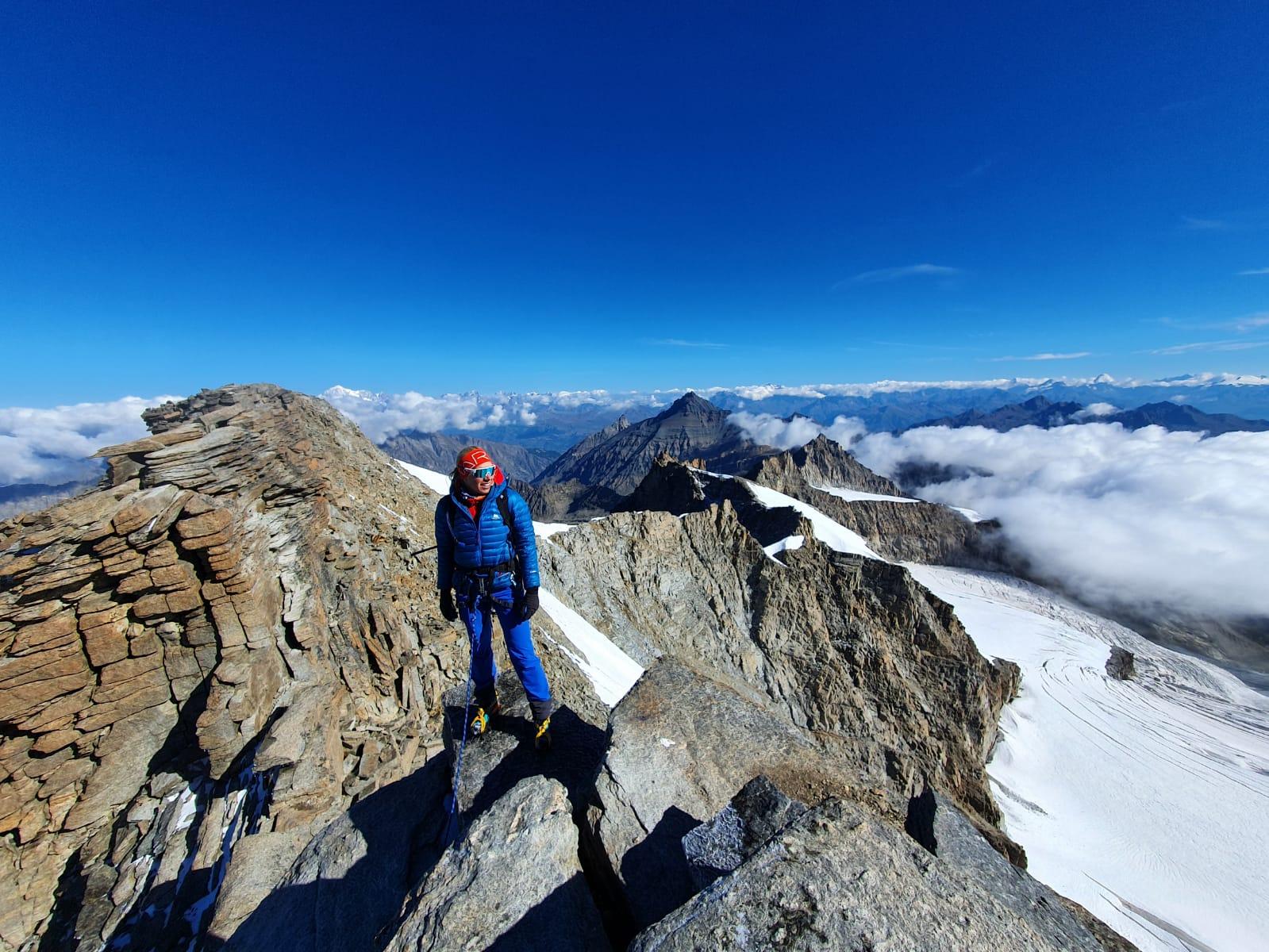 The author of the piece on a mountain summit. Photo: Amy Kilpin