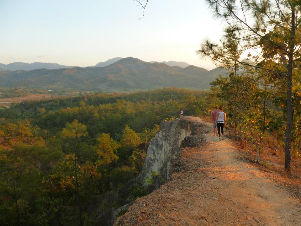 Hikers at a viewpoint near Pai, Thailand.