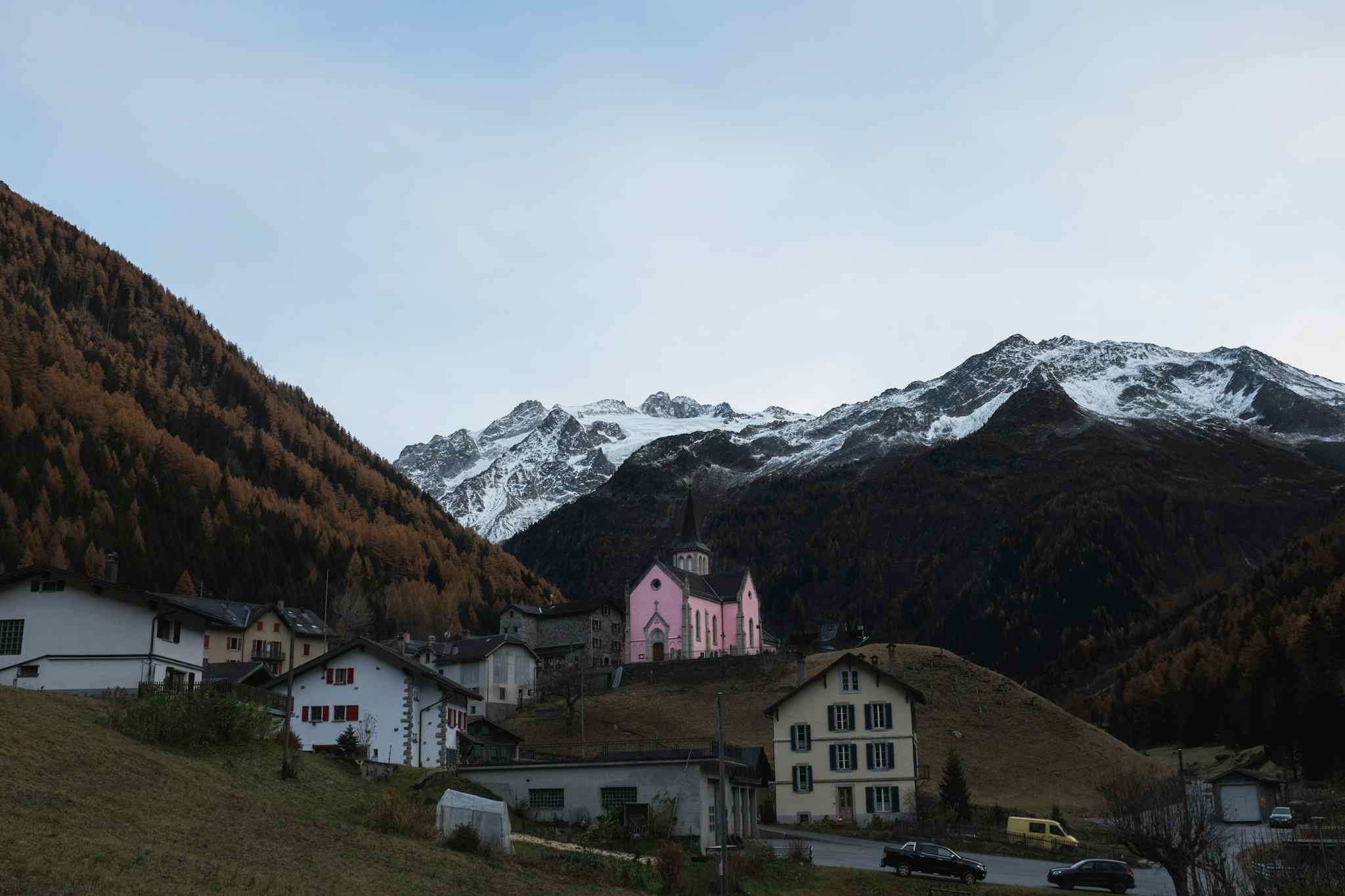 The small Alpine village of Trient, with its distinctive pink church. Photo: Getty.