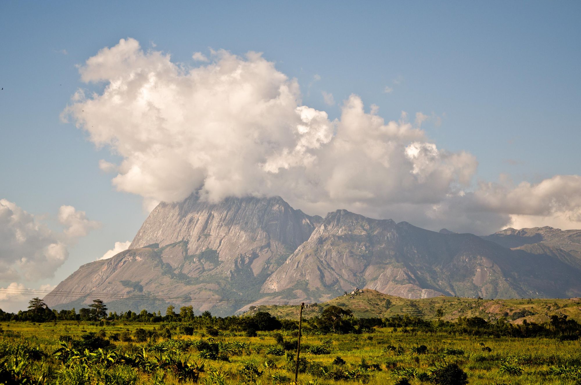 Capped with clouds, Mount Mulanje rises above southern Malawi. Photo: Getty