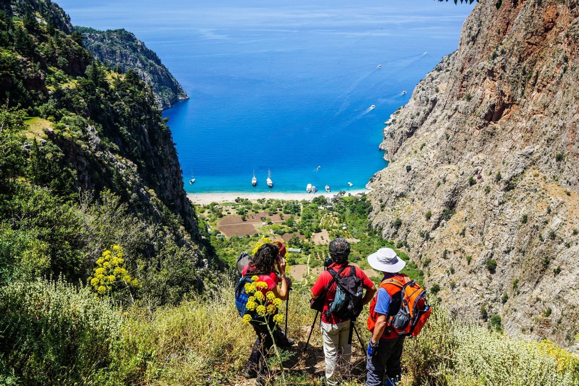 Hikers look out over Butterfly Valley, along the Lycian Way. Photo: Getty.