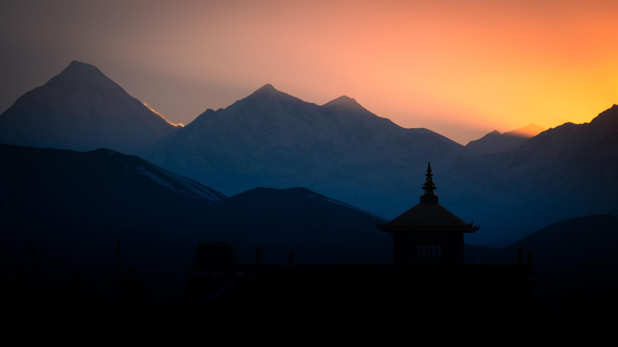 The sun sets over the monasteries of Nepal, high in the Himalayas. Photo: Josh Edwards
