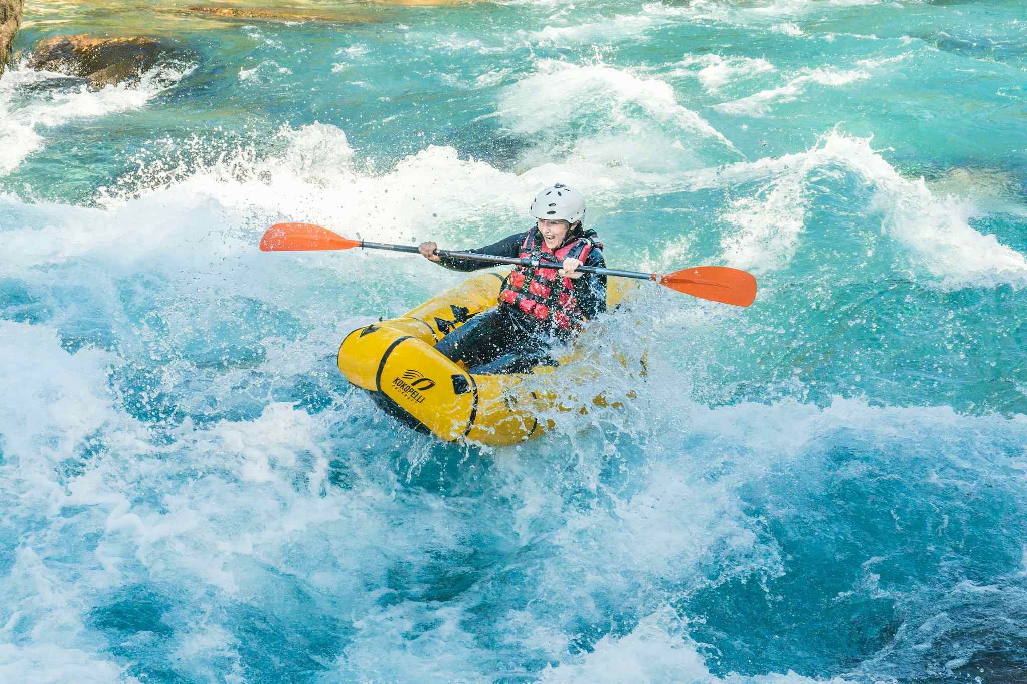A woman packrafts a white water section of the Tara River, Montenegro. Photo: Balkan Expeditions