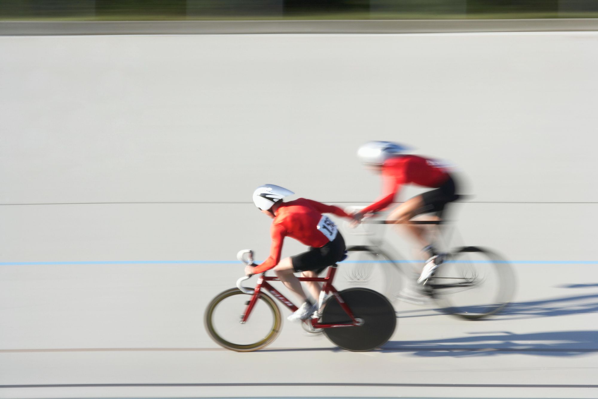 One racer propels their partner like a slingshot during a Madison race on track. Photo: Getty