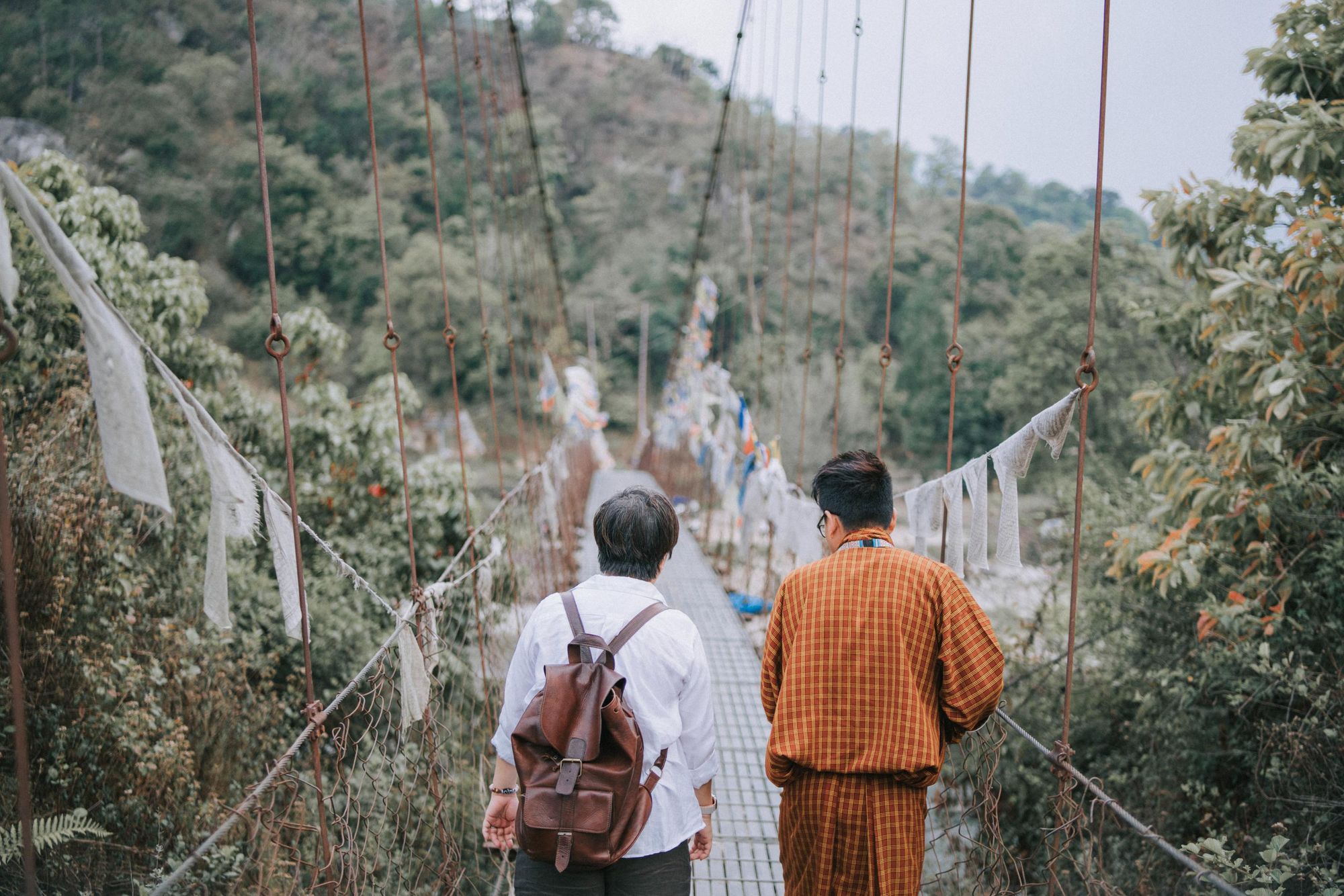 Walking over the iron bridge of Paro River in Bhutan. Photo: Getty