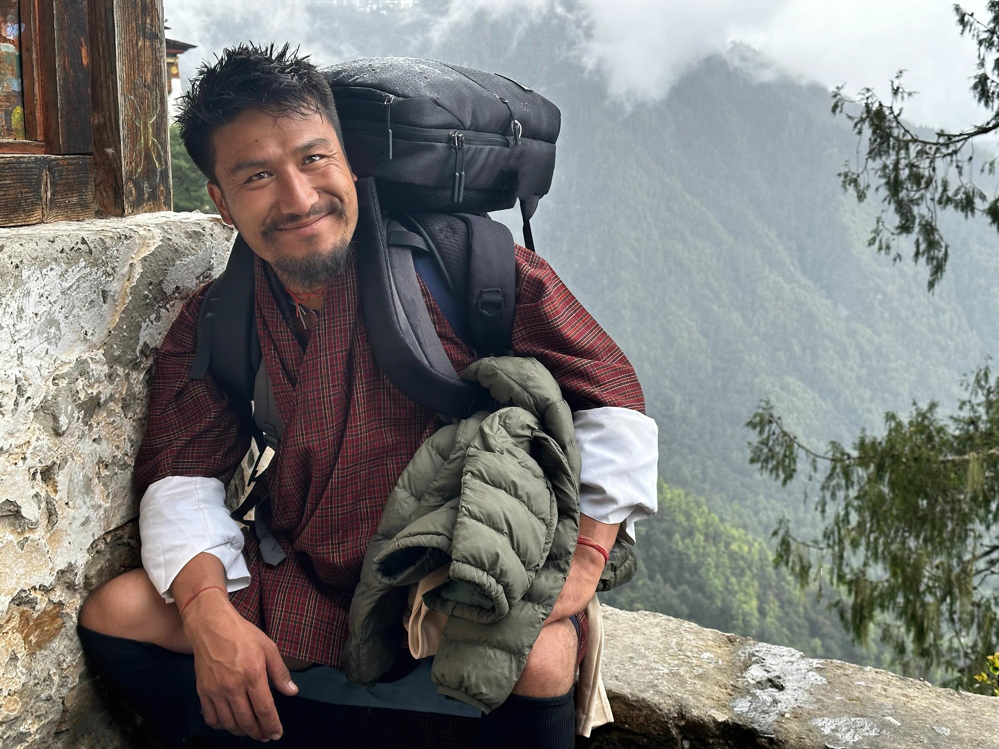 A Bhutanese mountain guide, high above the valleys in the mist. Photo: Getty