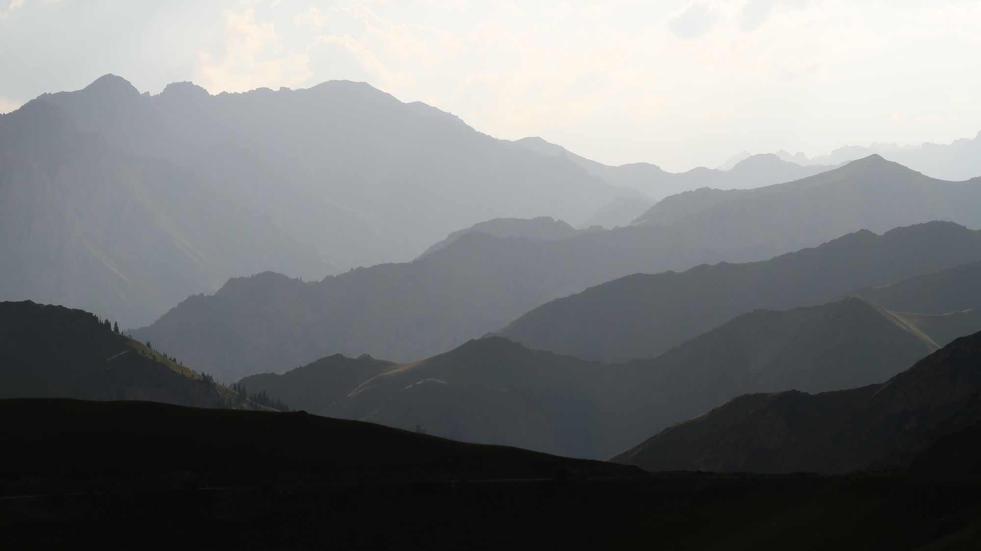 The lapping, layering mountains of Kyrgyzstan in evening light. Photo: Markus Stitz