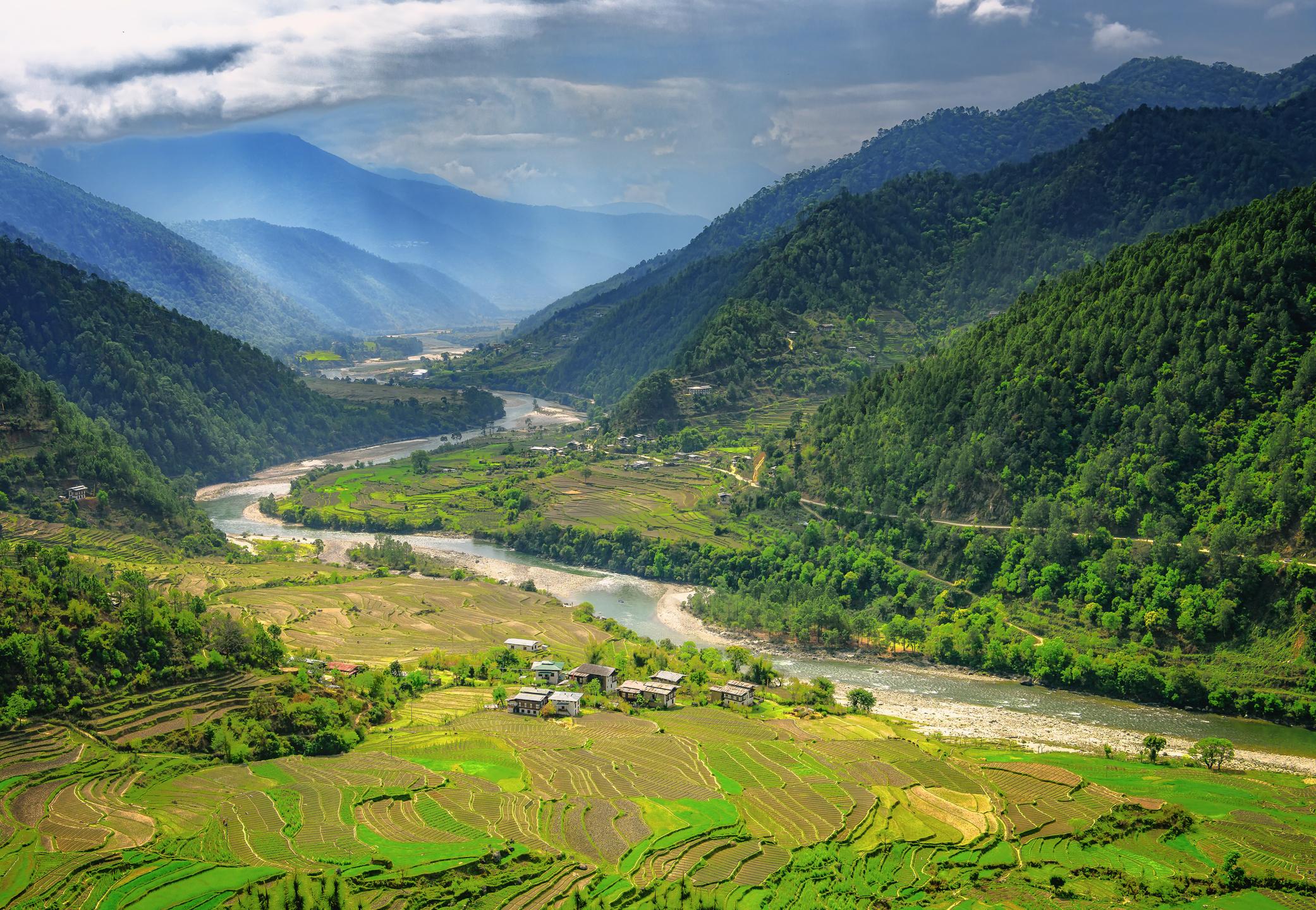 A valley in Bhutan near Punakha with rice fields and typical houses. Photo: Getty